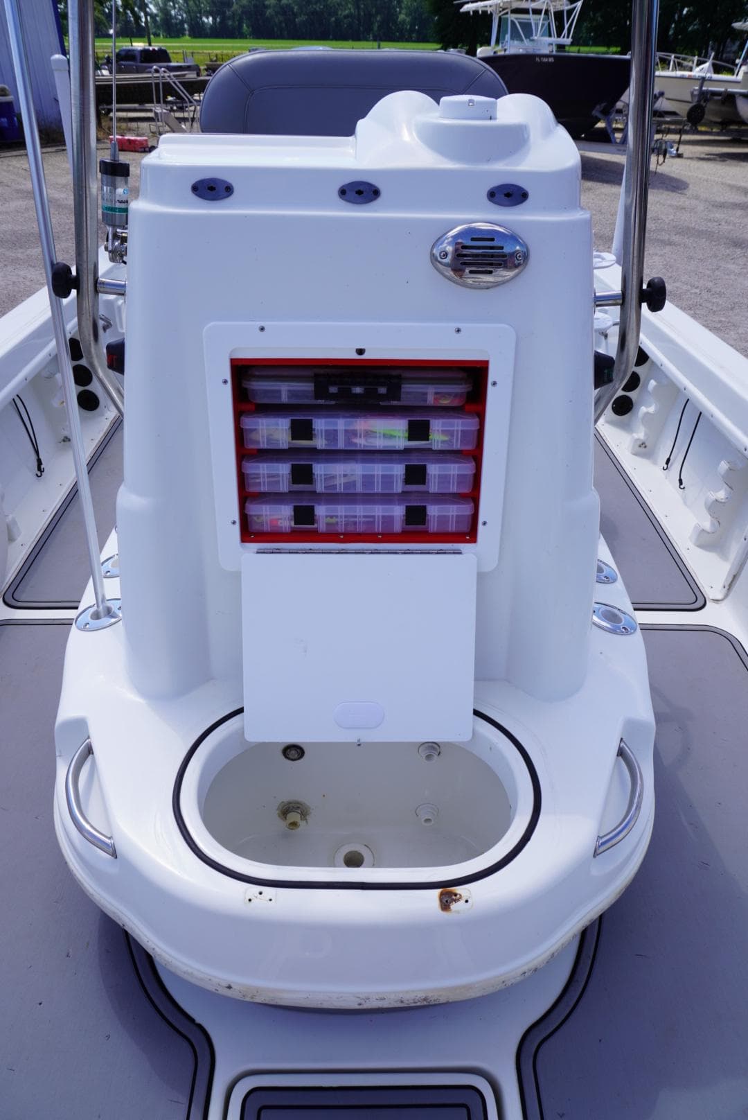 2014 NauticStar 244 XTS boat console with storage compartments and seating area.