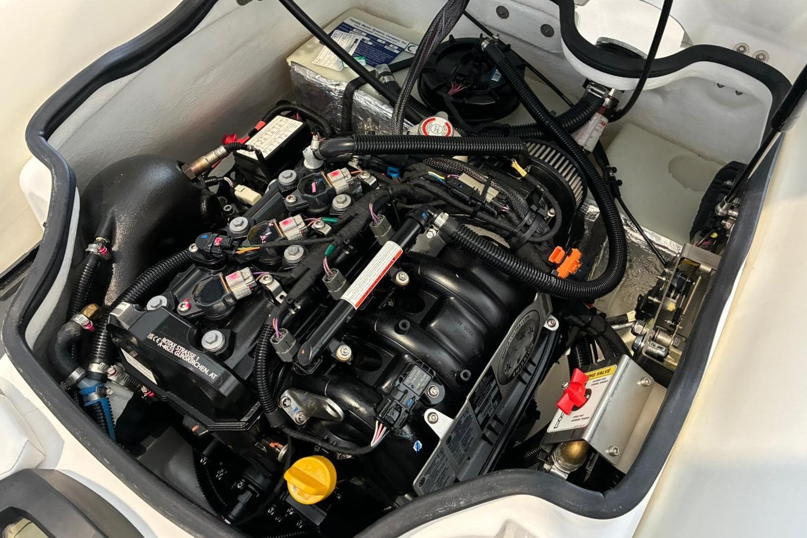 Engine compartment of 2024 Williams Jet Tenders Minijet 280, showcasing intricate mechanical components.