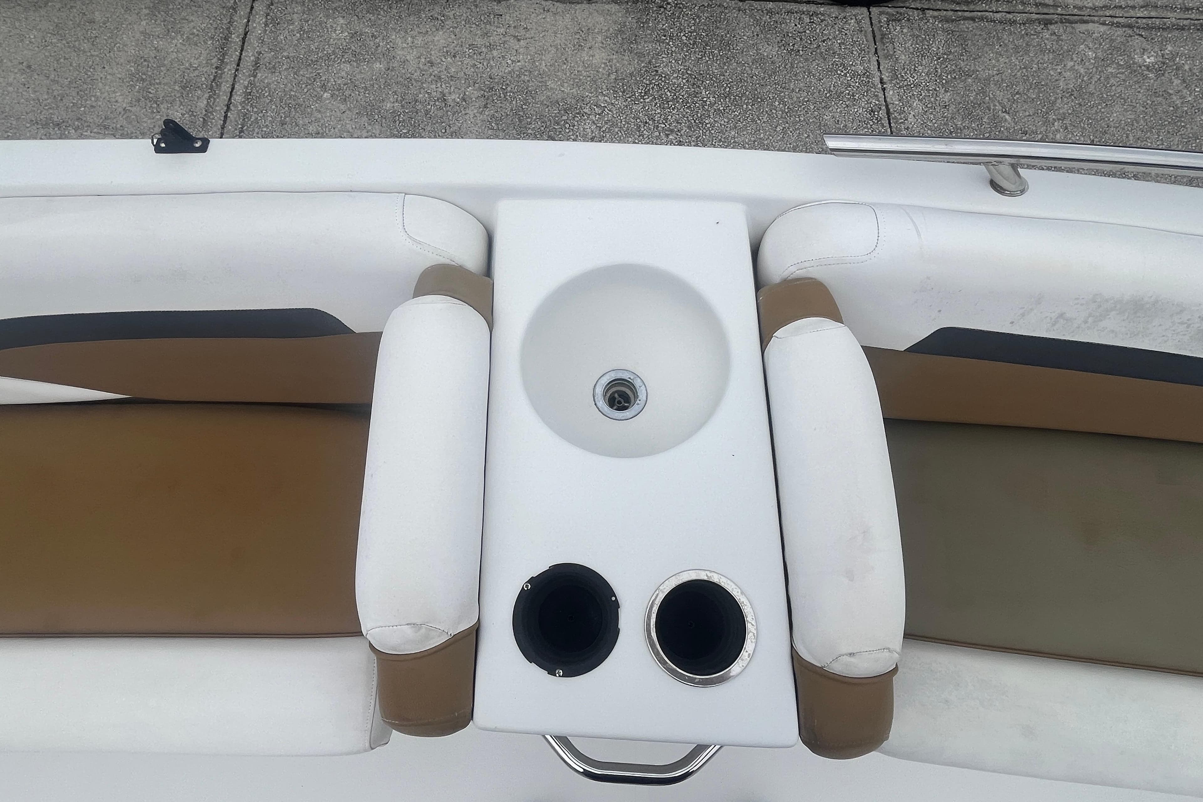 2021 Starcraft SVX 211 OB boat interior with seating and built-in sink.