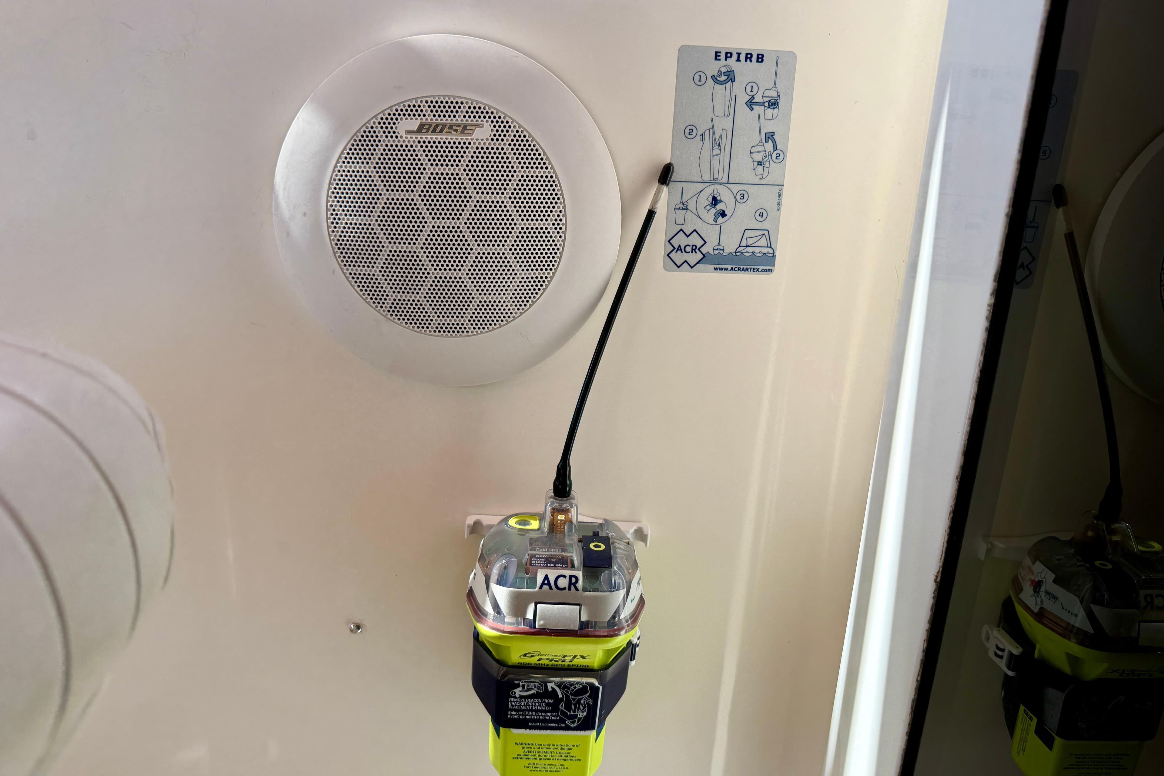 Bose speaker and EPIRB device on 1999 Legacy 40 boat interior.