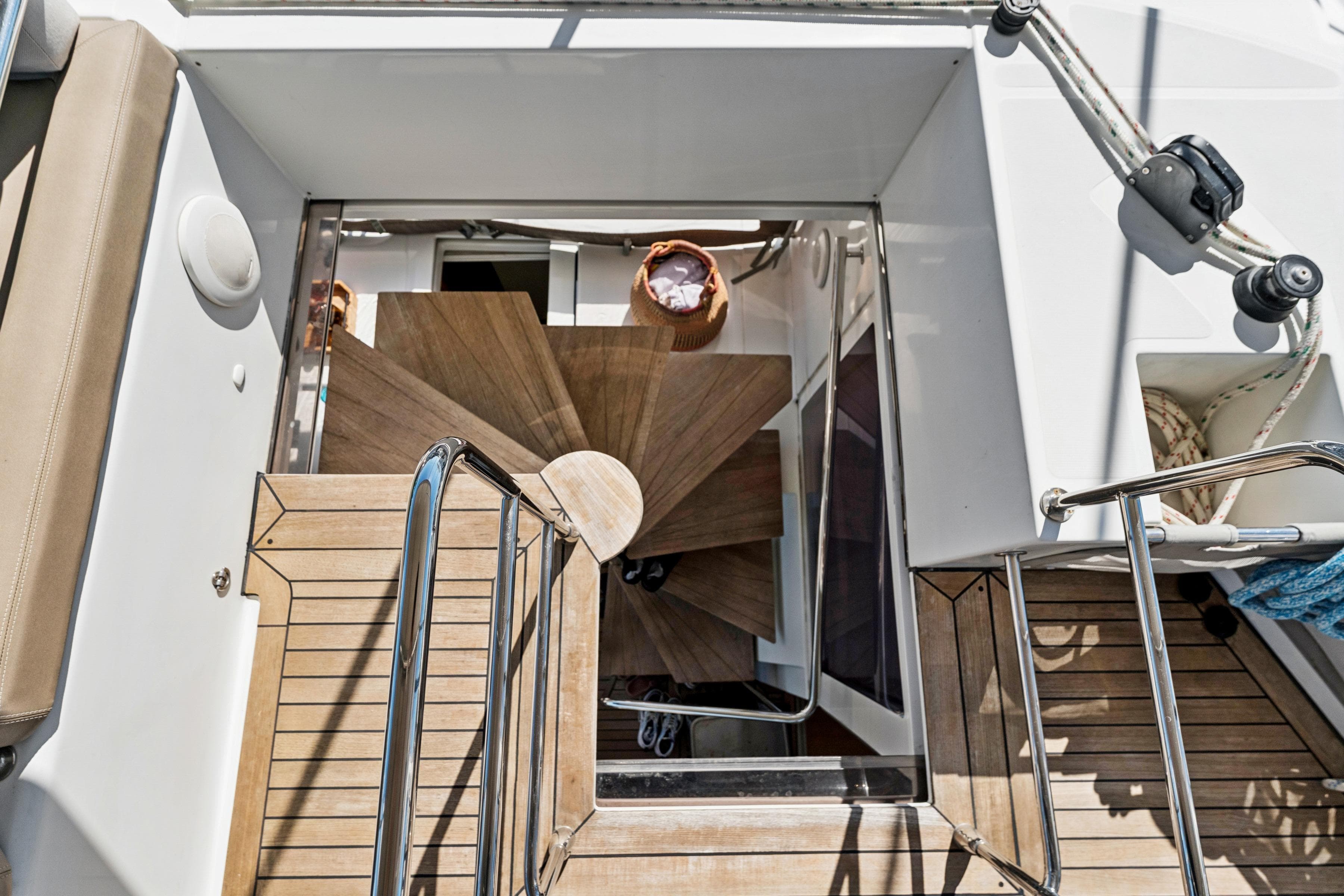 Staircase on 2012 Lagoon 560 yacht, featuring wooden steps and sleek design elements.