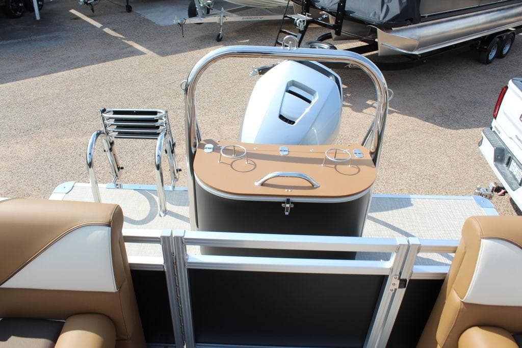 2026 Avalon Venture 85 Quad Lounger boat interior with motor and seating area.