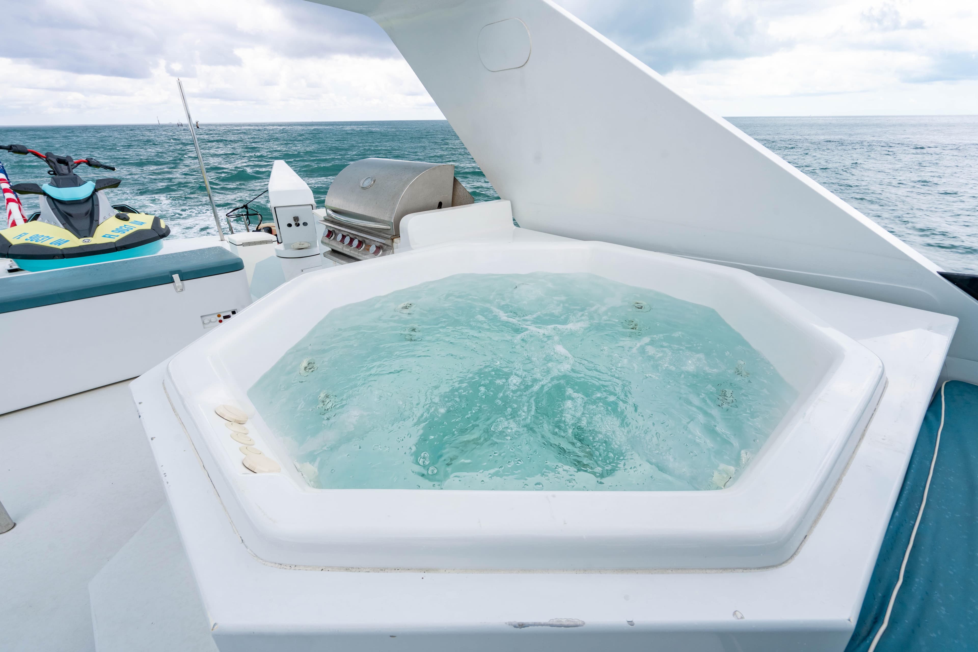 Luxurious 2006 Broward Raised Pilothouse yacht with jacuzzi and ocean view.