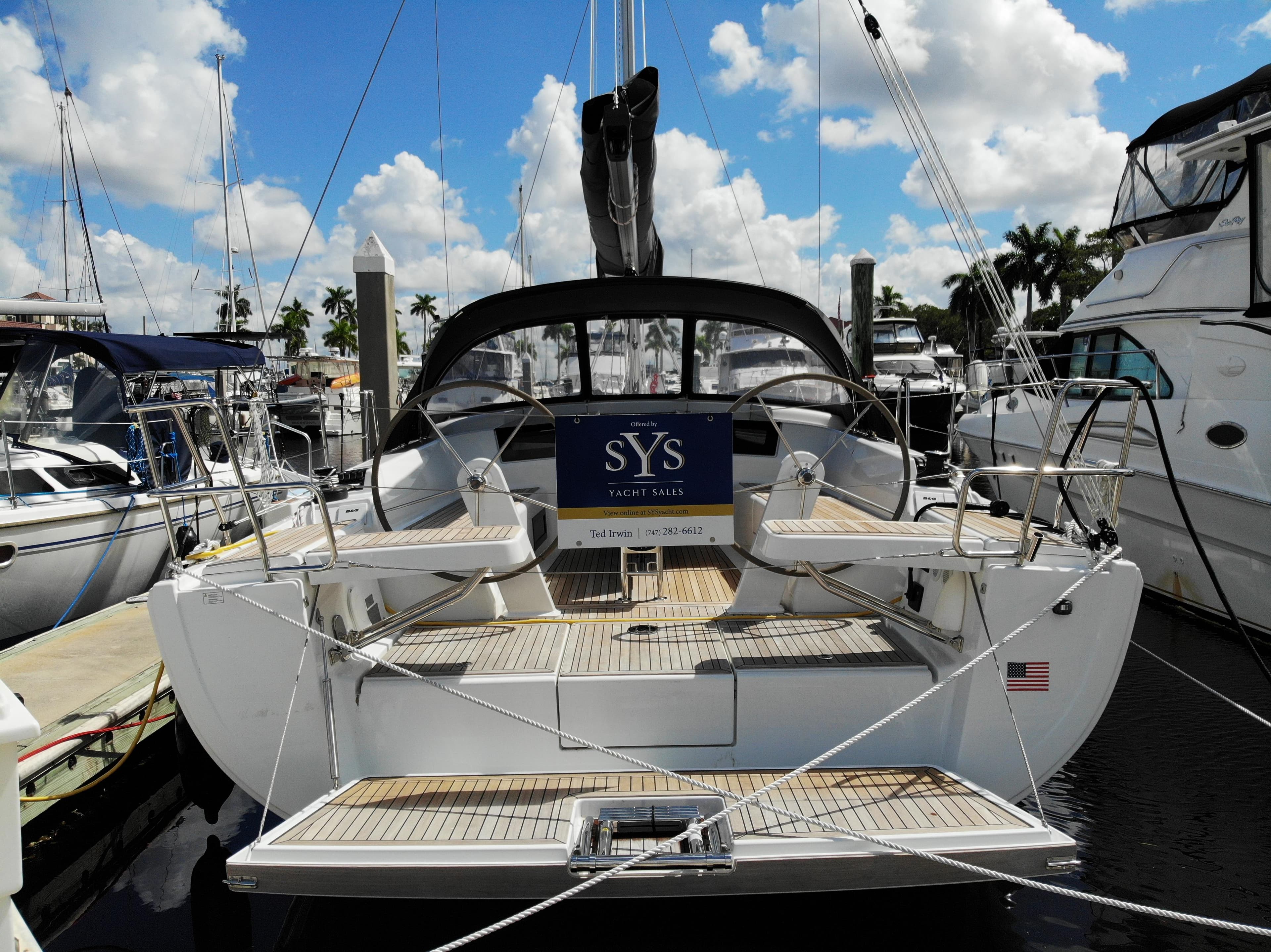 2024 Hanse 388 yacht docked at marina under blue sky.