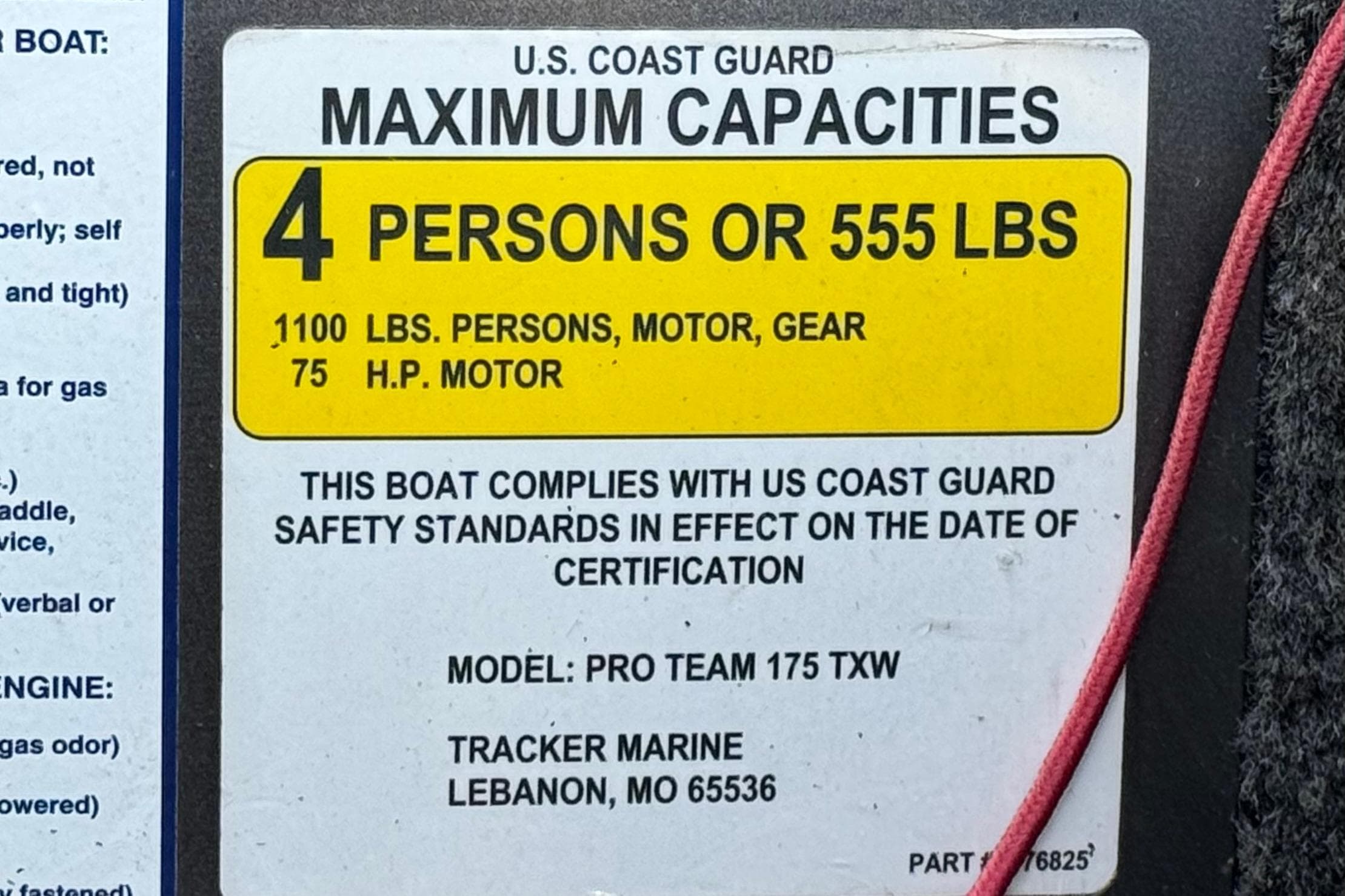 2019 Tracker Pro Team 175 capacity label, 4 persons or 555 lbs, US Coast Guard compliant.