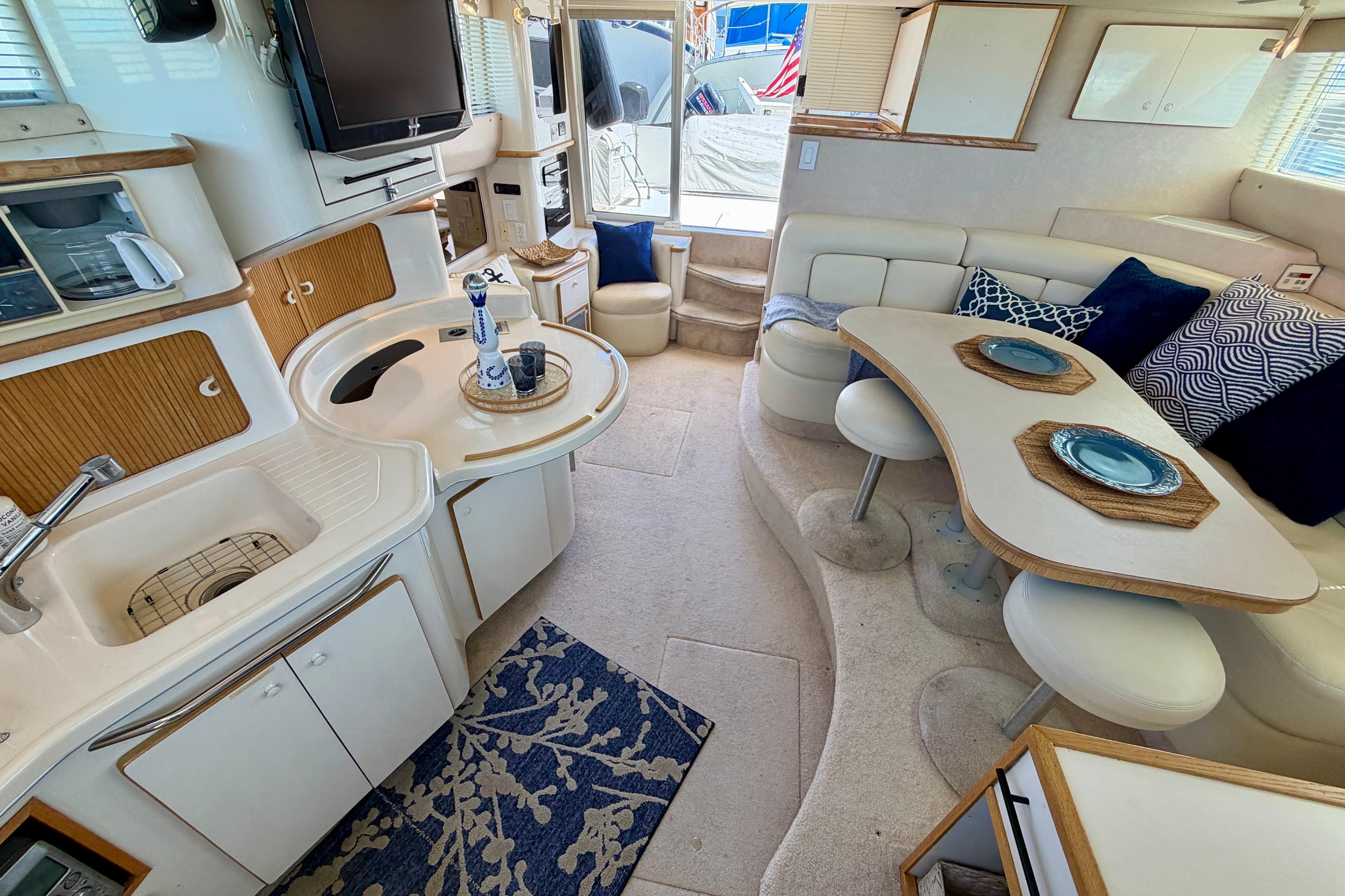 Luxurious interior of a 1994 Sea Ray 440 Express Bridge yacht with modern amenities.