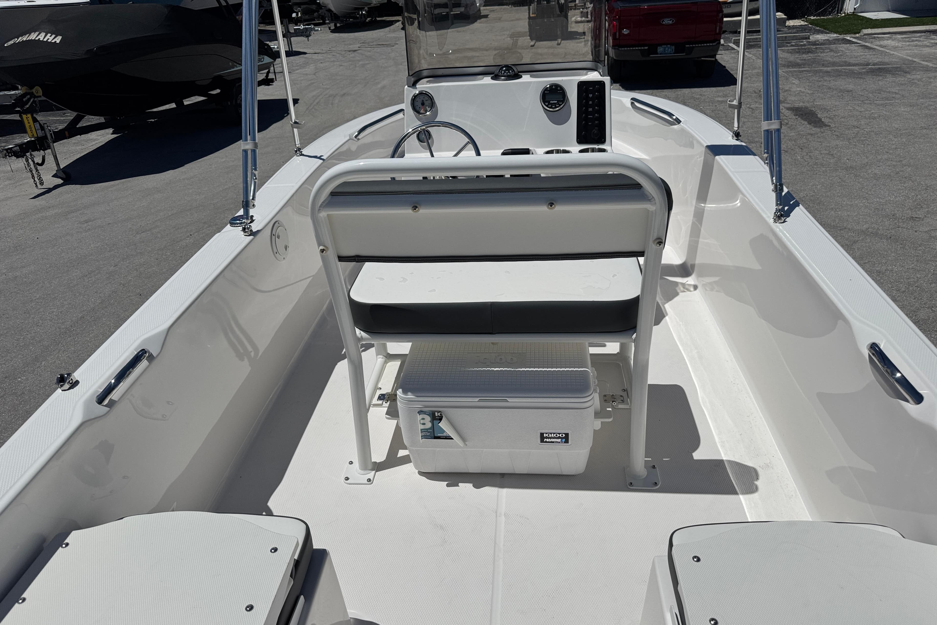 2025 Robalo R160 Center Console boat interior with seating and cooler.