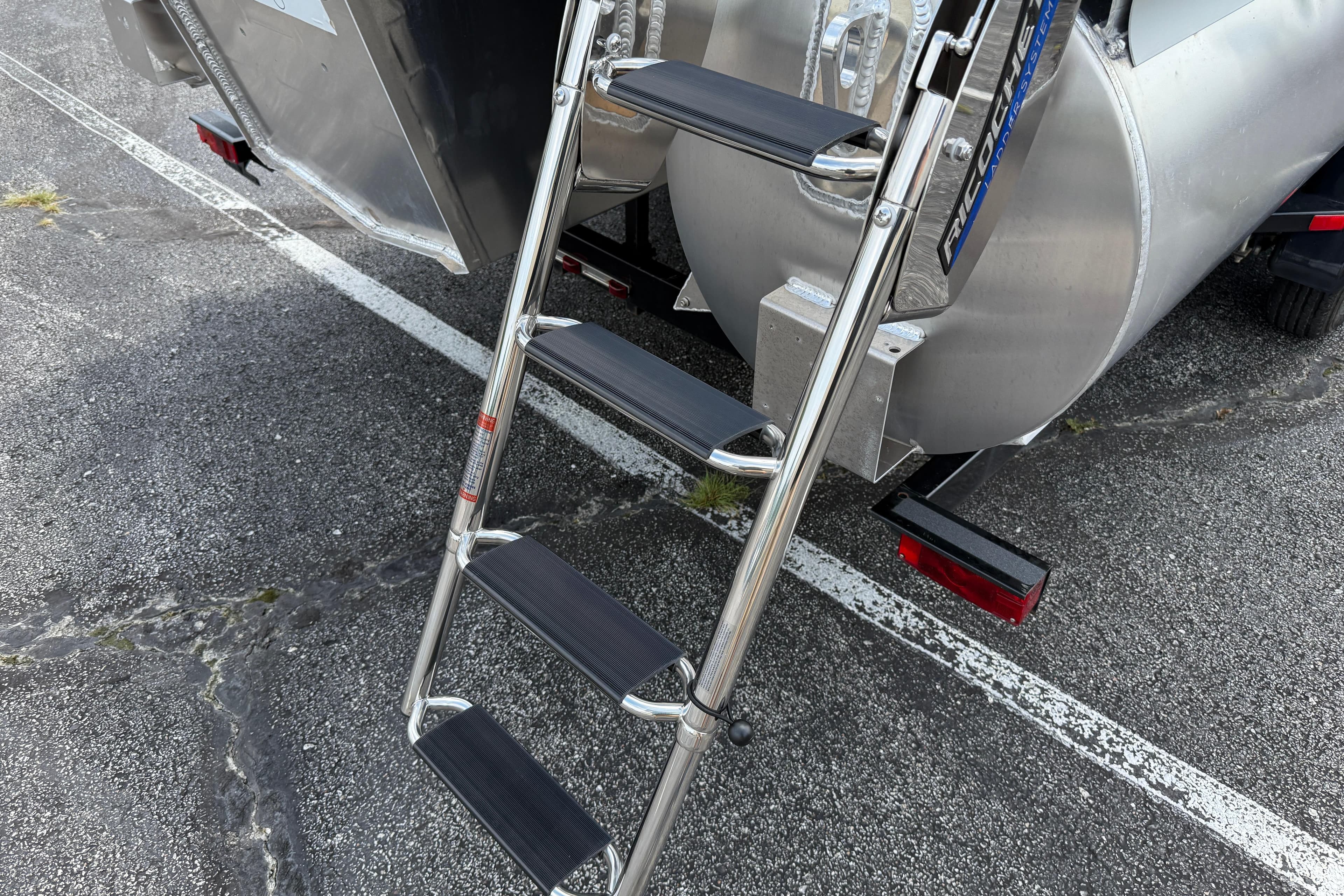 Stainless steel ladder on 2026 Premier 230 SunSation RF pontoon boat.