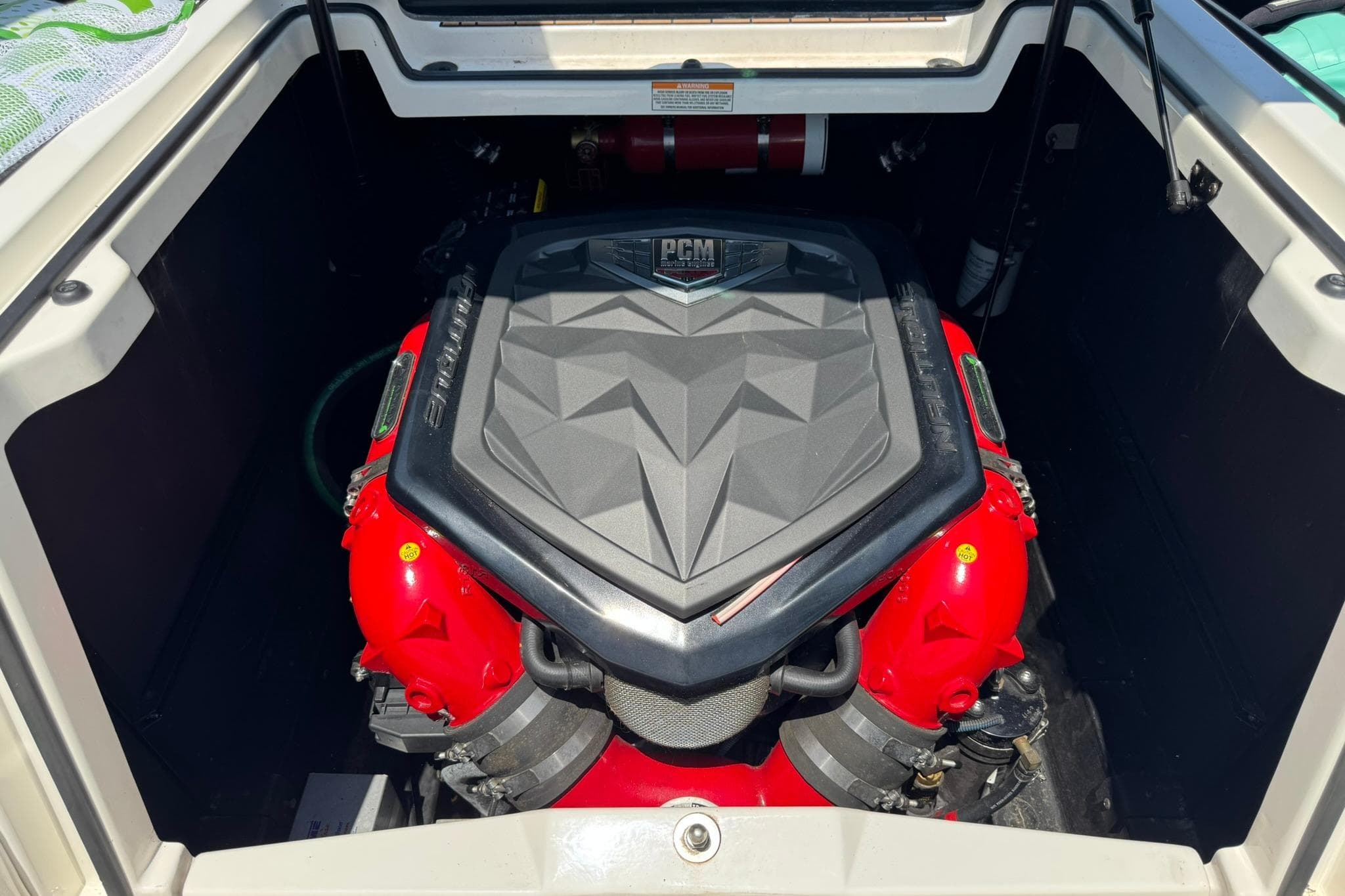 Engine compartment of 2017 Nautique Super Air Nautique G23 boat, featuring PCM engine.