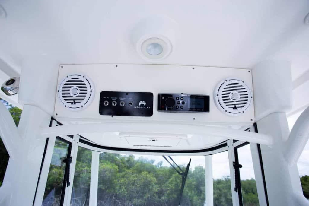 2026 World Cat 295CC boat console with speakers and control panel.