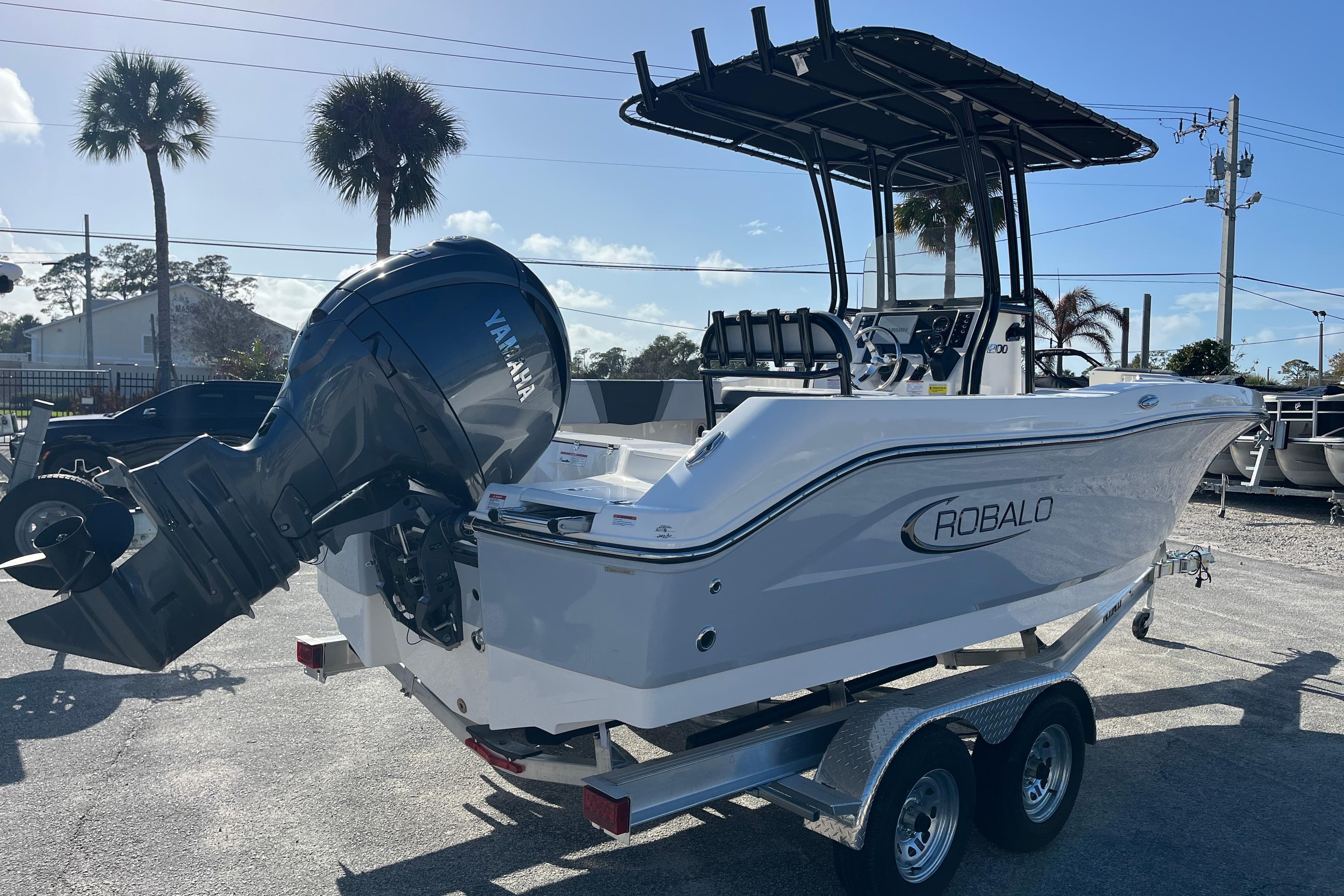 2026 Robalo R200 Center Console boat with Yamaha engine on trailer.