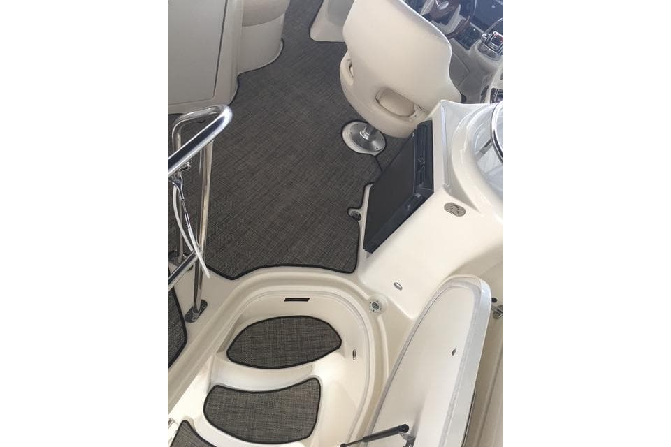Interior view of a 2009 Meridian 391 Sedan yacht with carpeted flooring and seating.