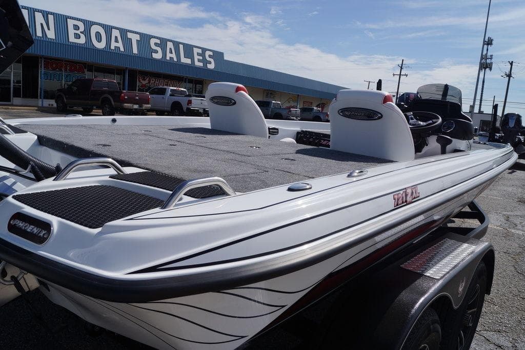 2026 Phoenix 721 ZXL boat displayed at a dealership, showcasing sleek design and features.