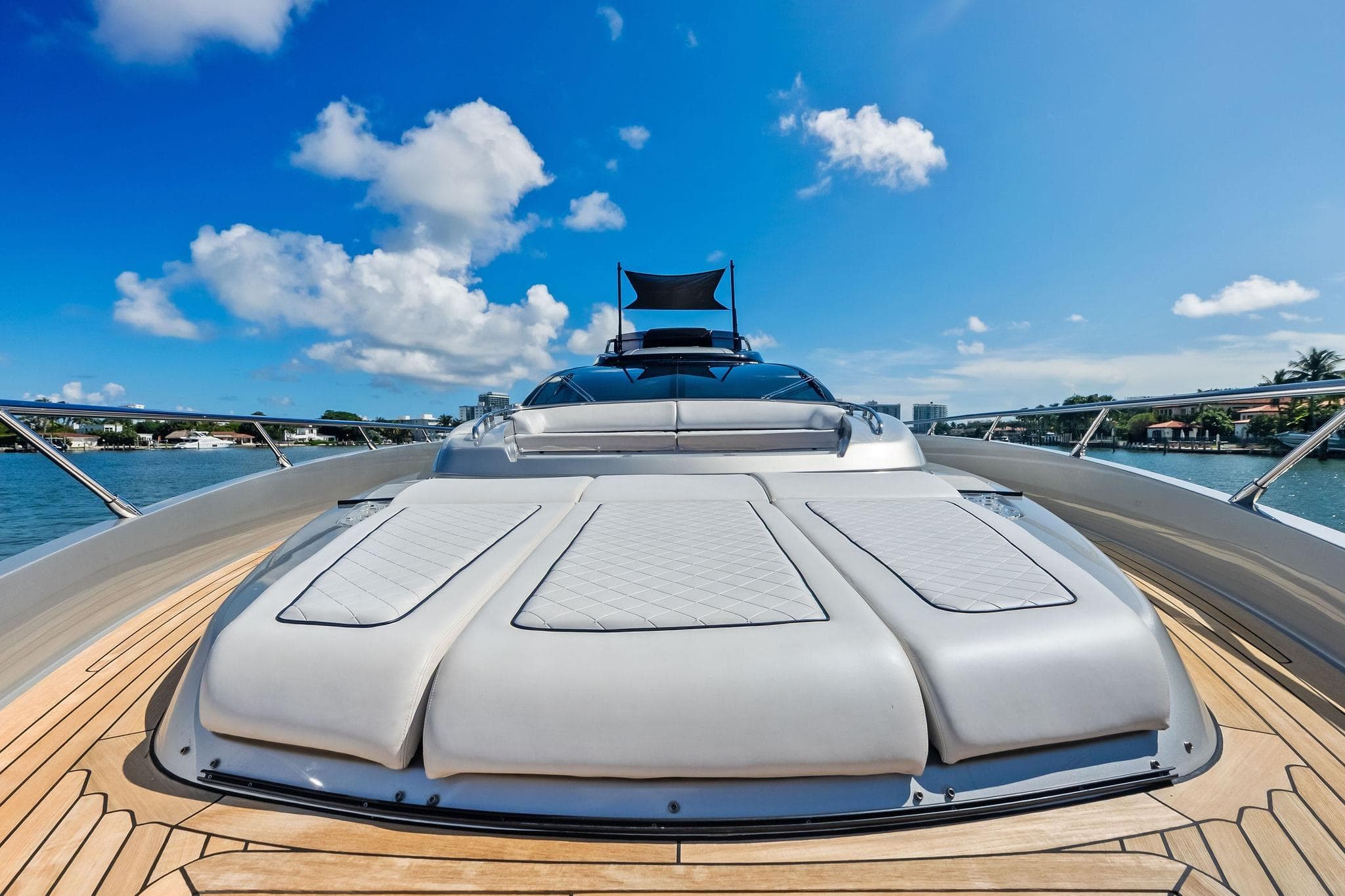 Luxurious 2023 Riva 76 PERSEO Super yacht deck under clear blue sky.