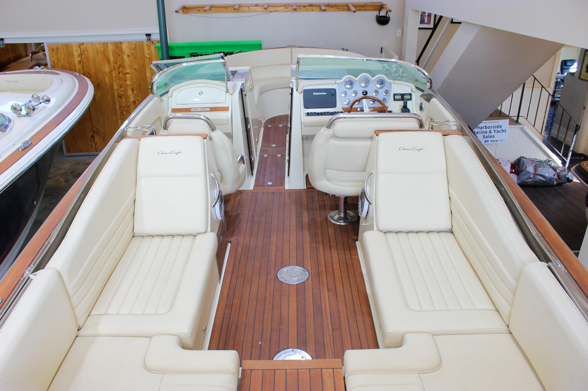 2013 Chris-Craft Launch 32 boat interior with elegant seating and wooden flooring.