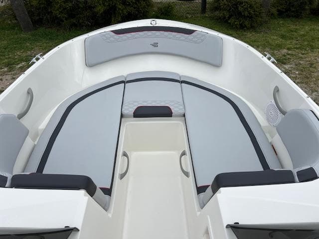2024 Bayliner Element M19 boat interior with cushioned seating.