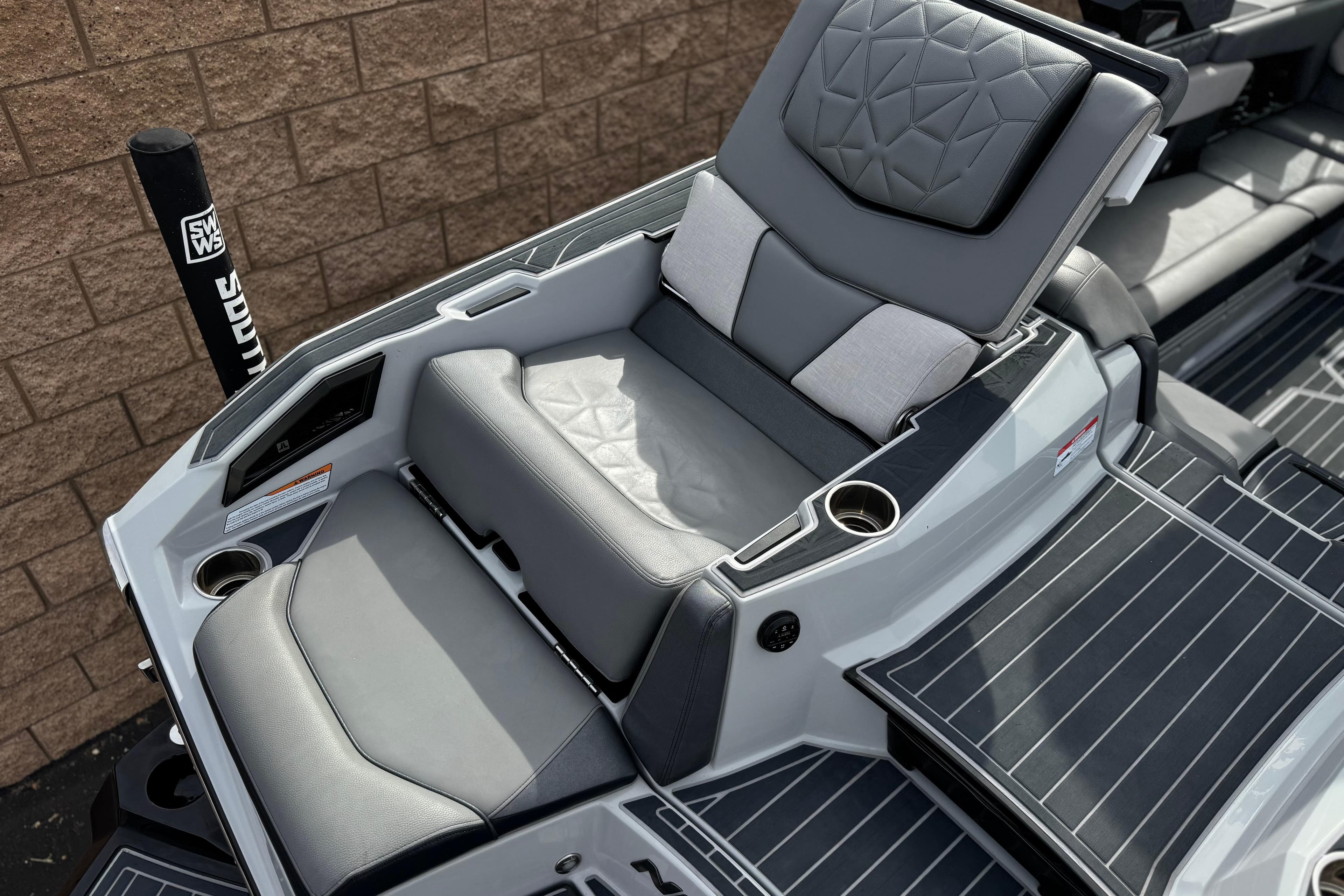 2022 Nautique Super Air Nautique G25 Paragon boat seating with luxurious gray upholstery.