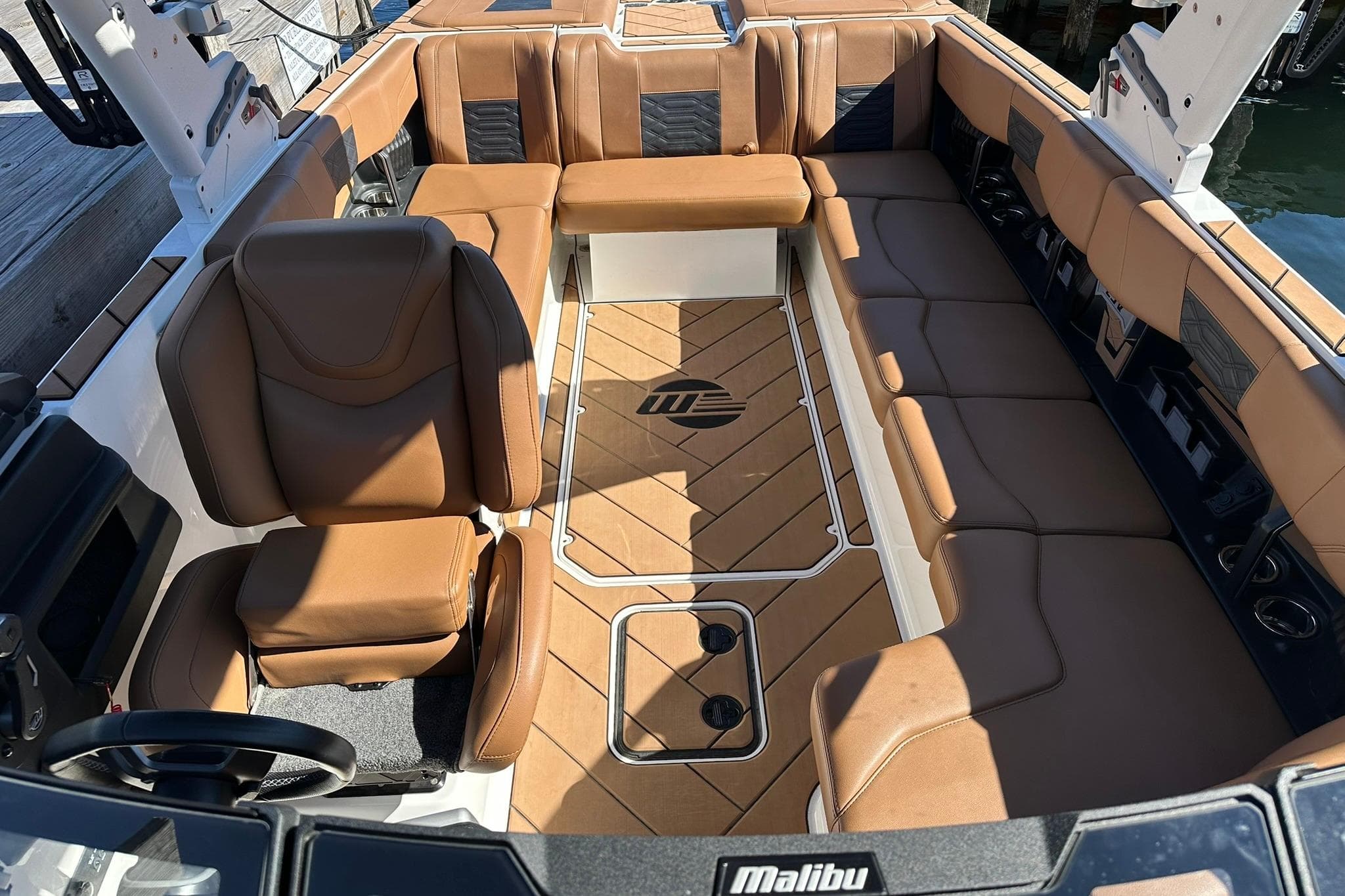 2024 Malibu Wakesetter 25 LSV interior with luxurious brown seating and sleek design.