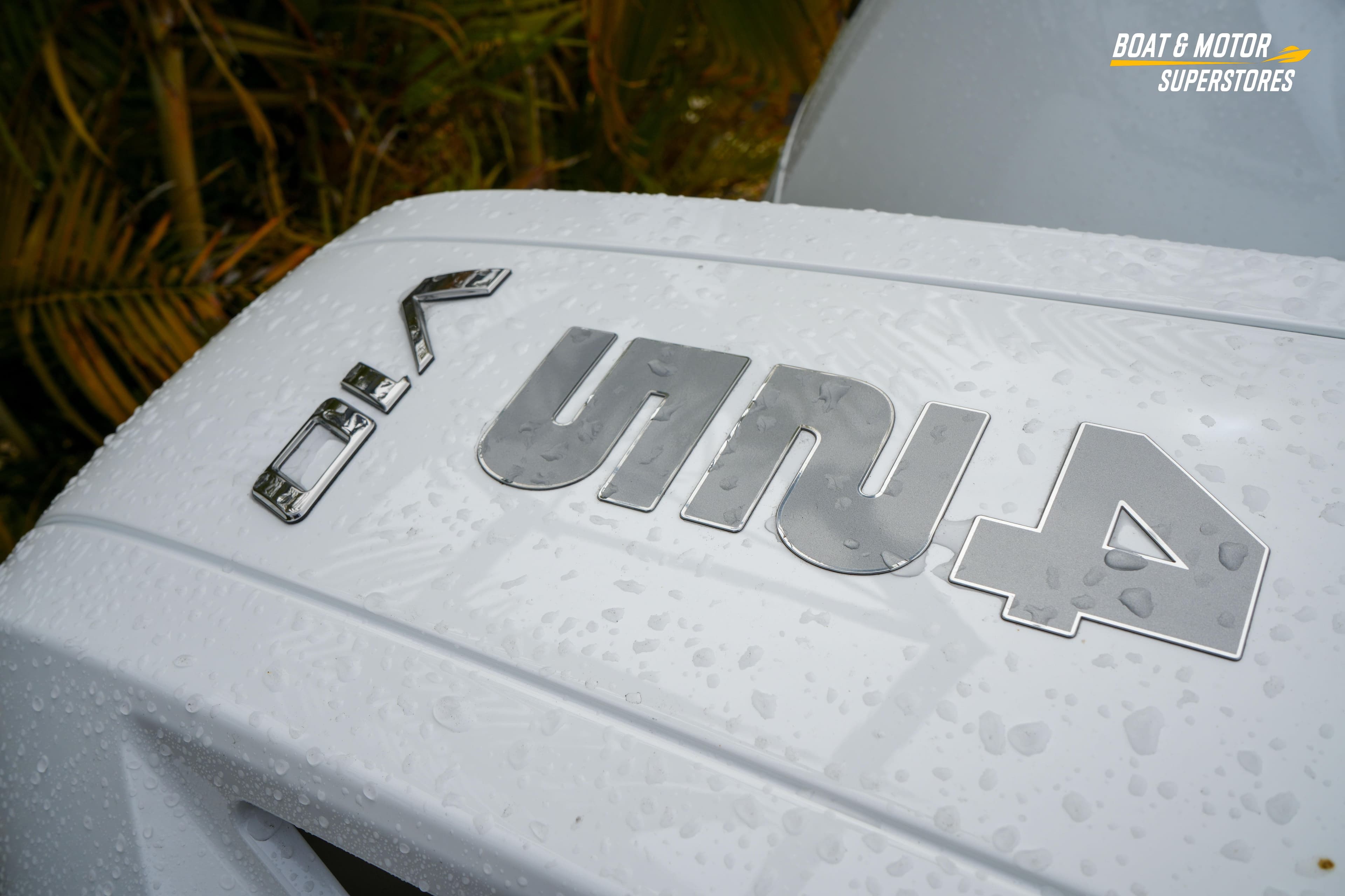 2026 Blackfin 332 CC boat with wet surface and logo detail.