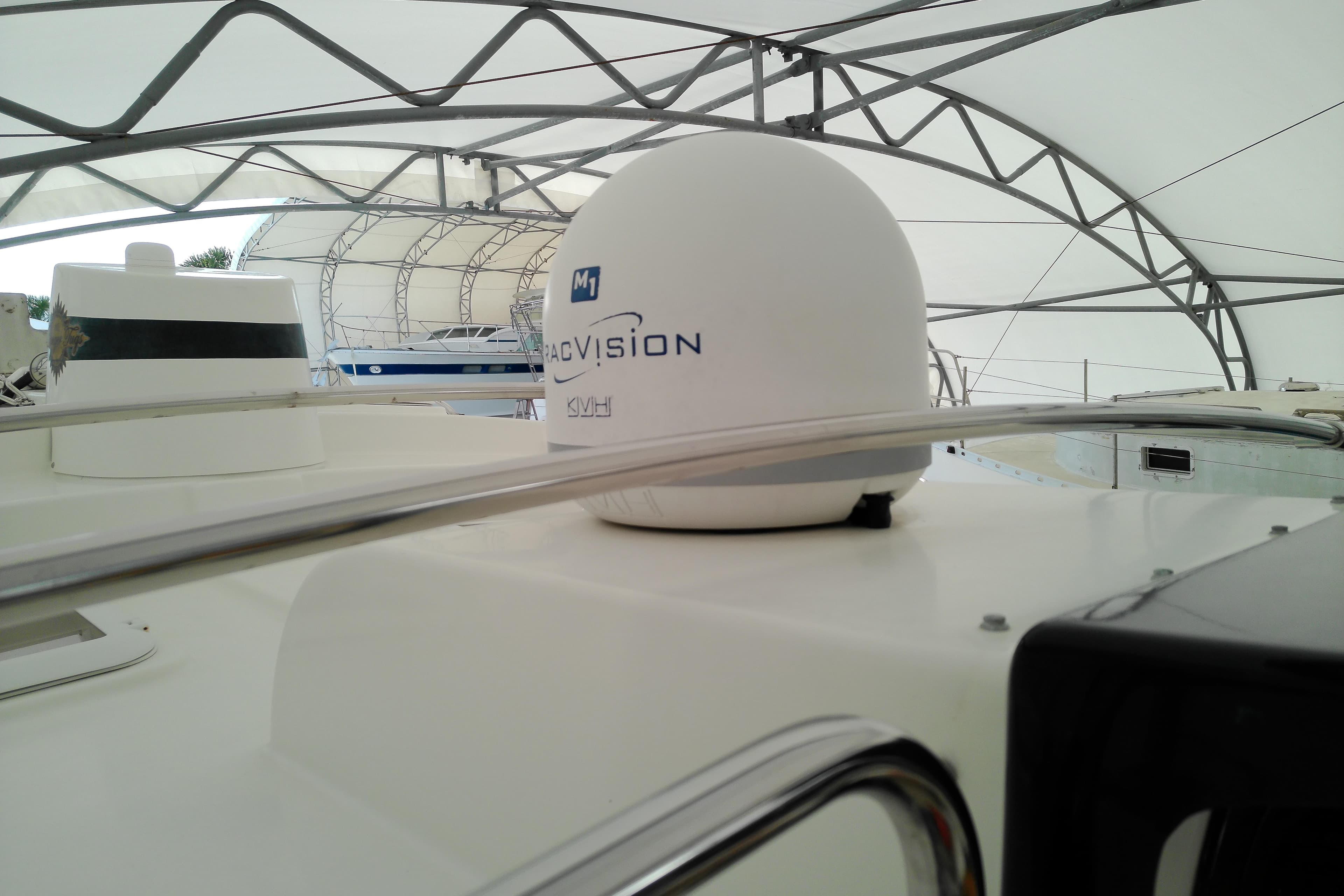 2010 Ranger Tugs R-25 boat with KVH TracVision satellite dome under canopy.