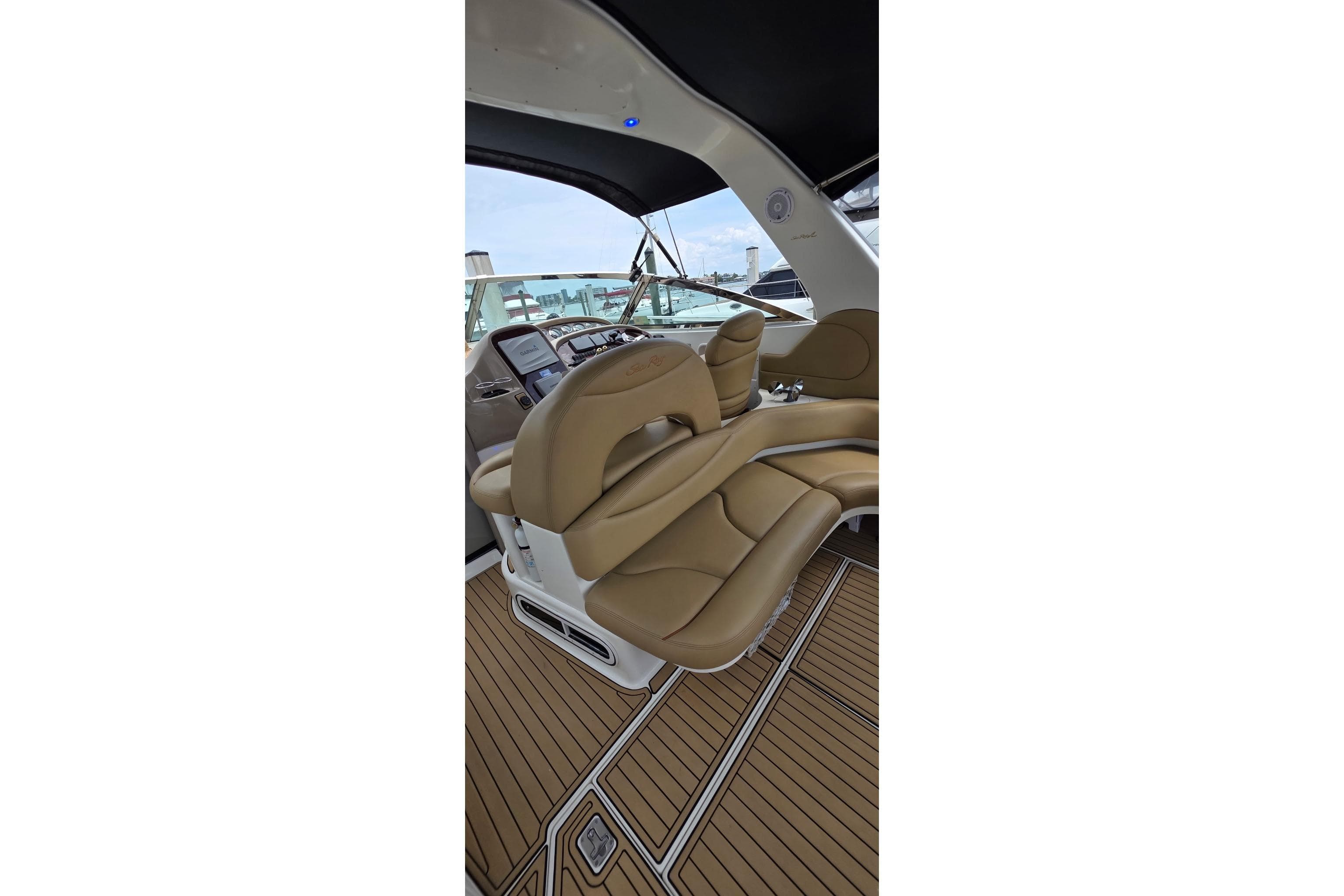 Interior view of 2002 Sea Ray 380 Sundancer yacht with tan leather seating.