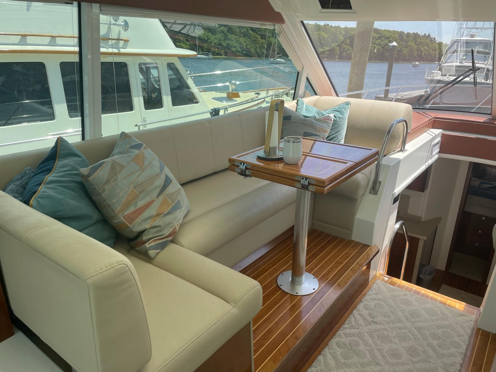 Luxurious interior of 2012 Cruisers Yachts 48 Cantius with elegant seating and table.