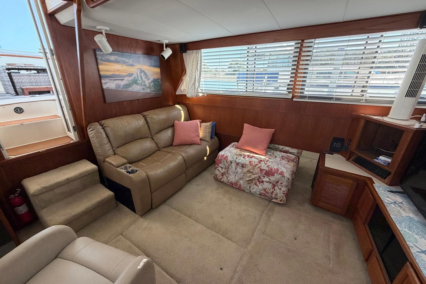 Interior of 1987 Viking 44 Motor Yacht with cozy seating and nautical decor.