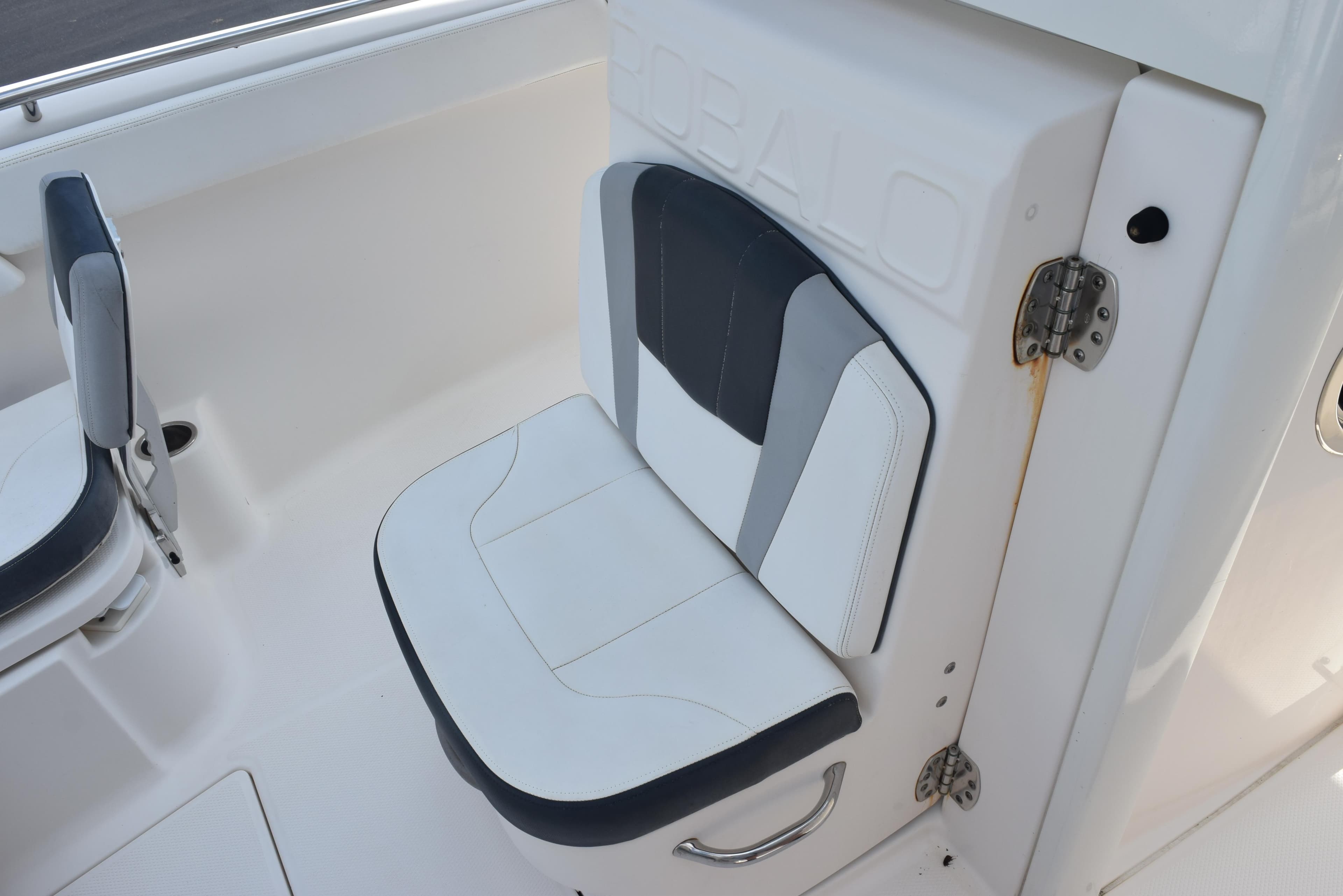 2019 Robalo R272 Center Console boat seat with white and gray upholstery.
