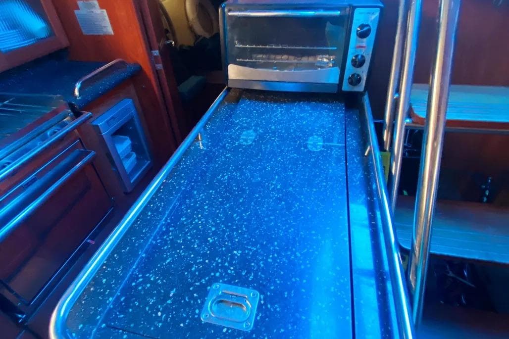 Interior of 2012 Hunter Aft Cockpit 50 yacht with modern kitchen amenities.