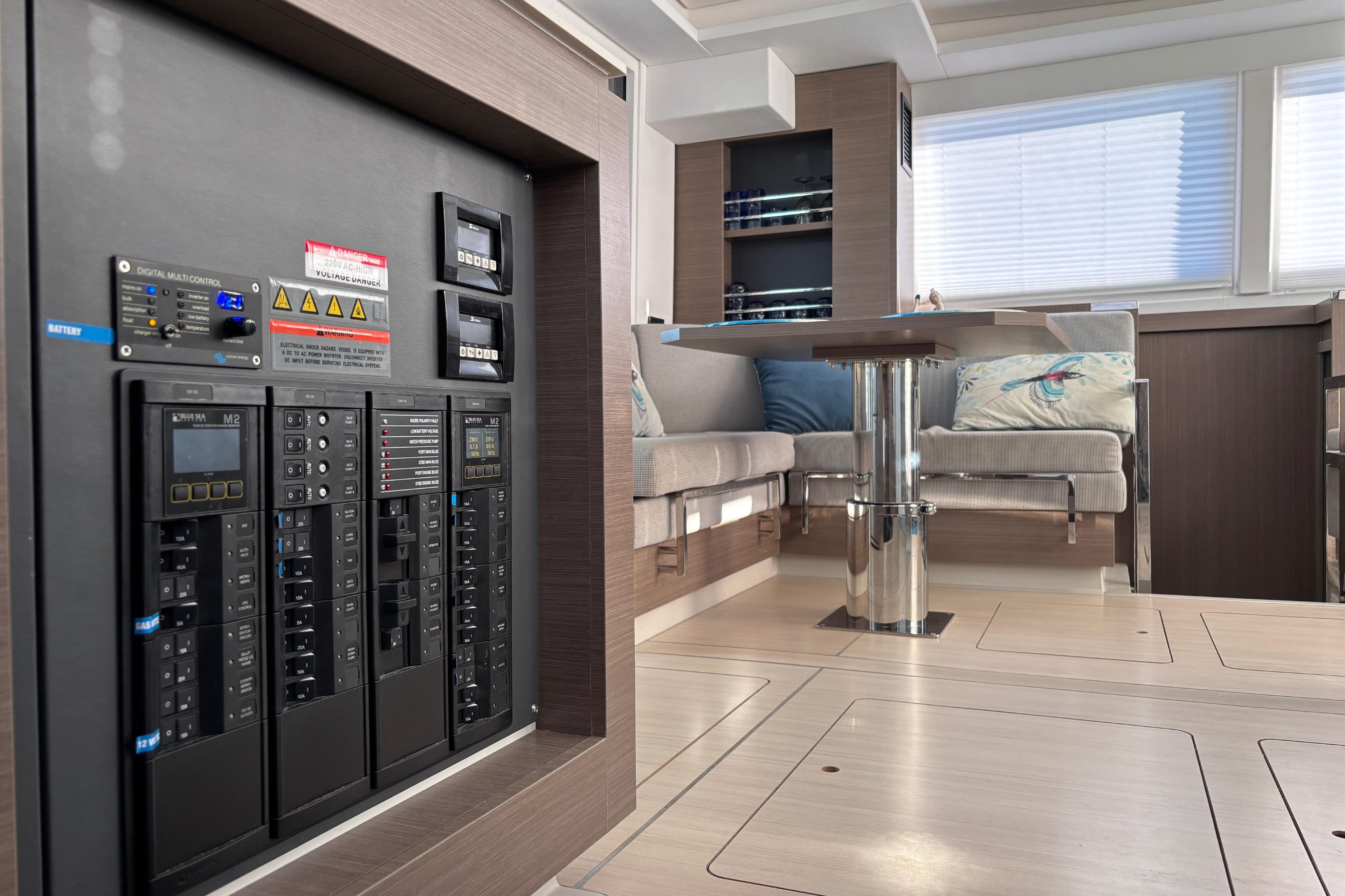 Modern interior of 2022 Leopard 42 yacht with control panel and seating area.