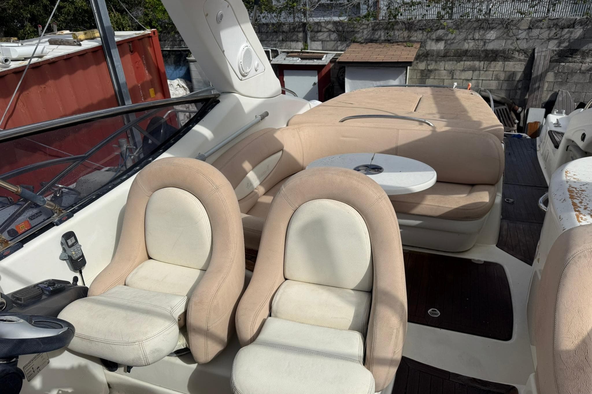 2009 Cranchi Endurance 41 yacht interior with beige seating and small round table.