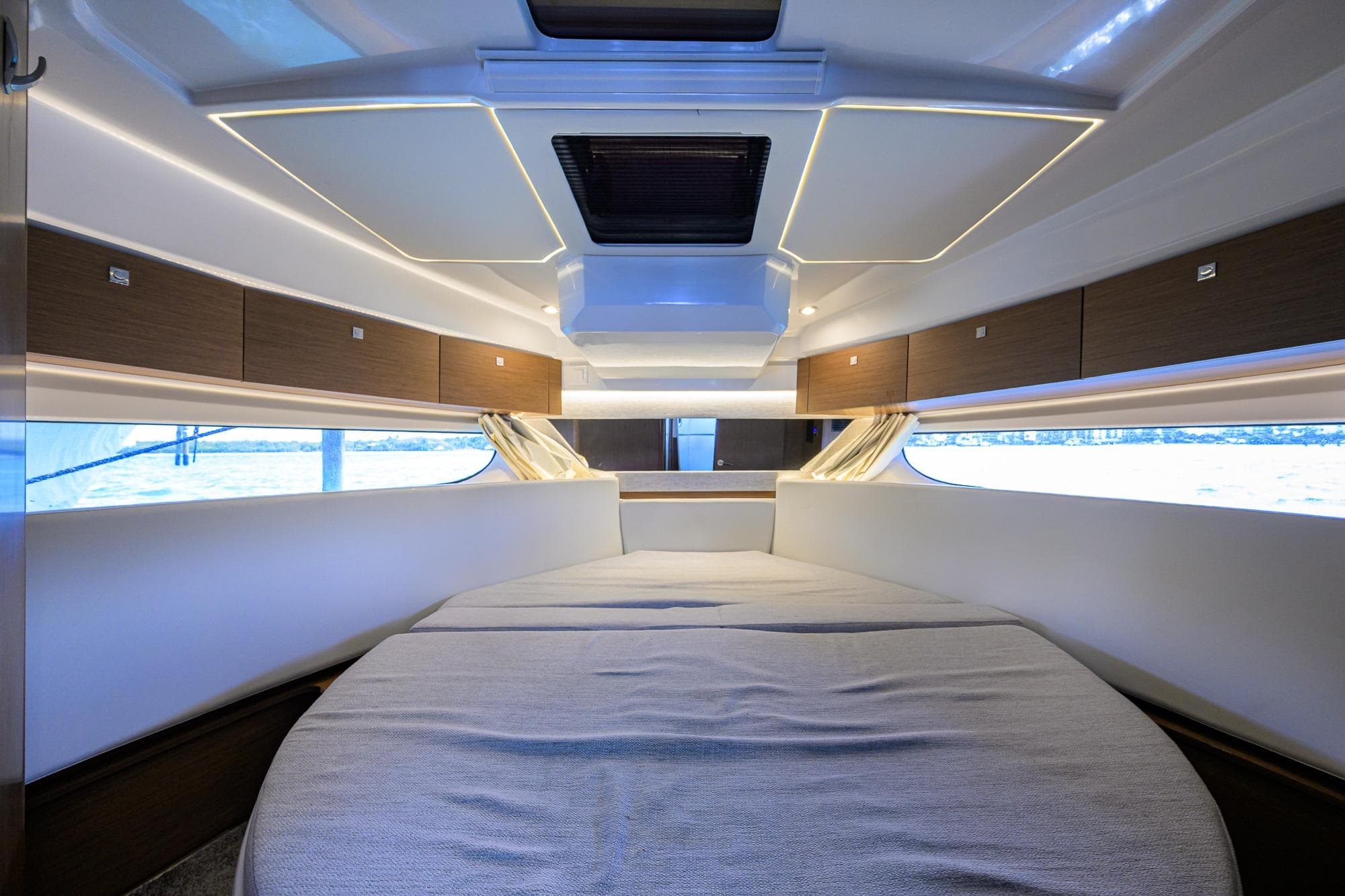2022 Jeanneau NC Weekender 1095 Fly cabin interior with modern design and ambient lighting.