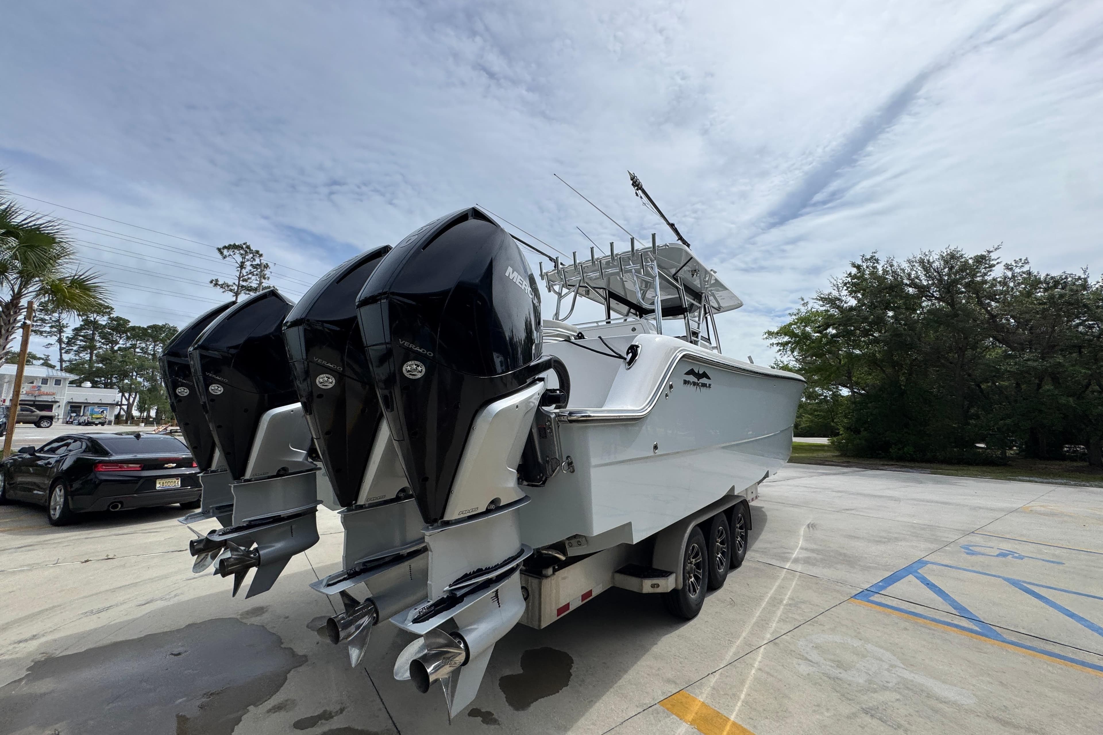 2020 Invincible 35 Catamaran with triple Mercury outboard engines on a trailer.
