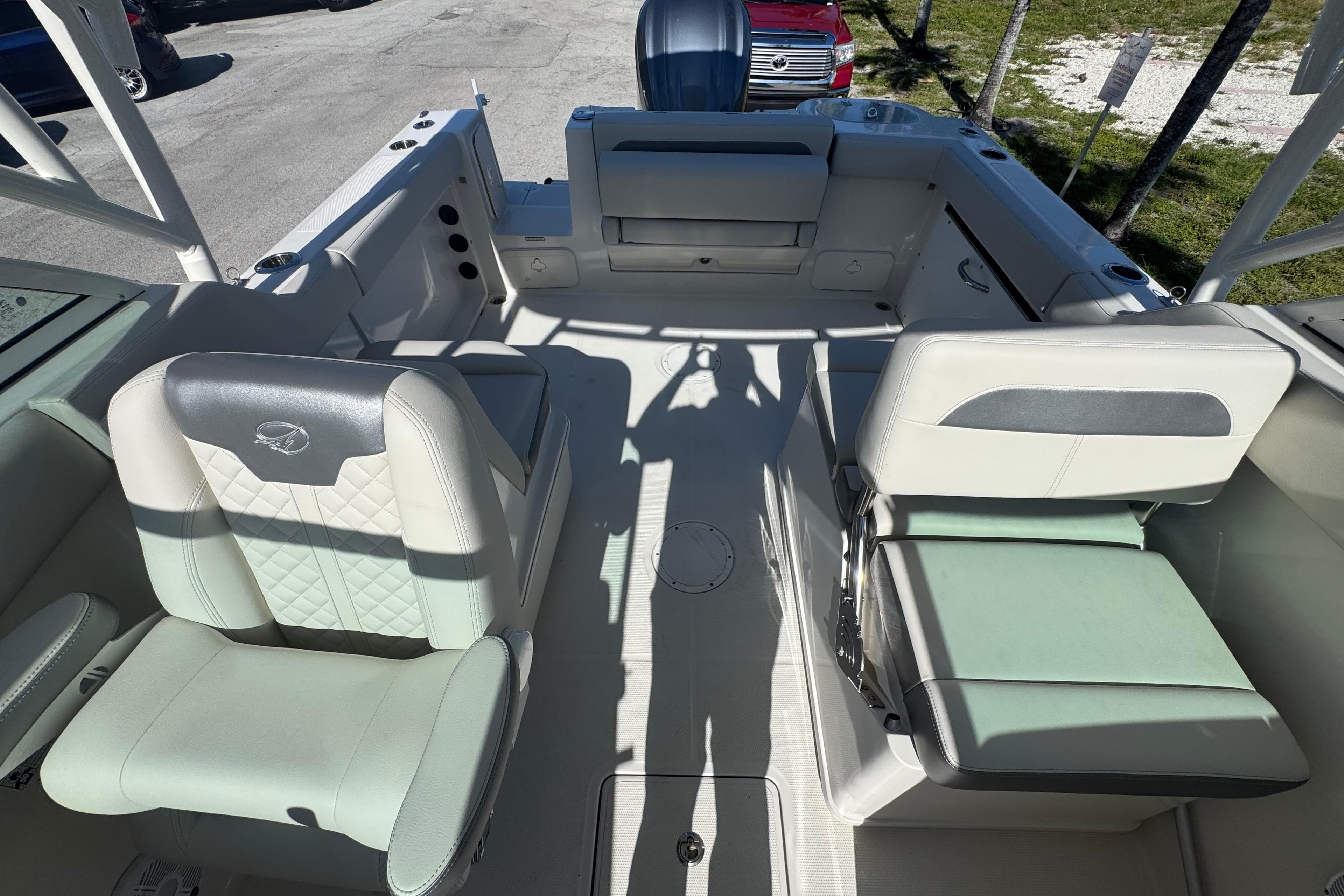 2023 Sailfish 245 DC boat interior with cushioned seating and modern design.