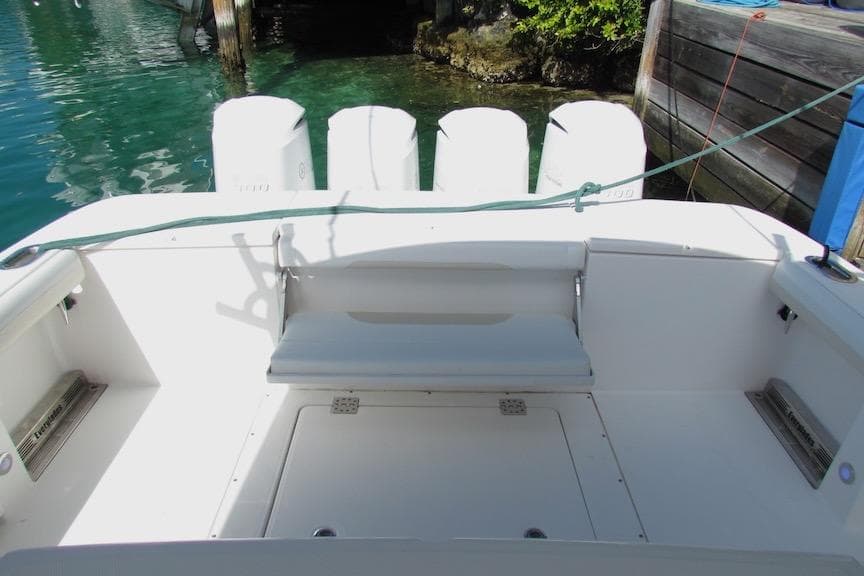 2016 Everglades 435 Center Console boat interior with seating and outboard motors.