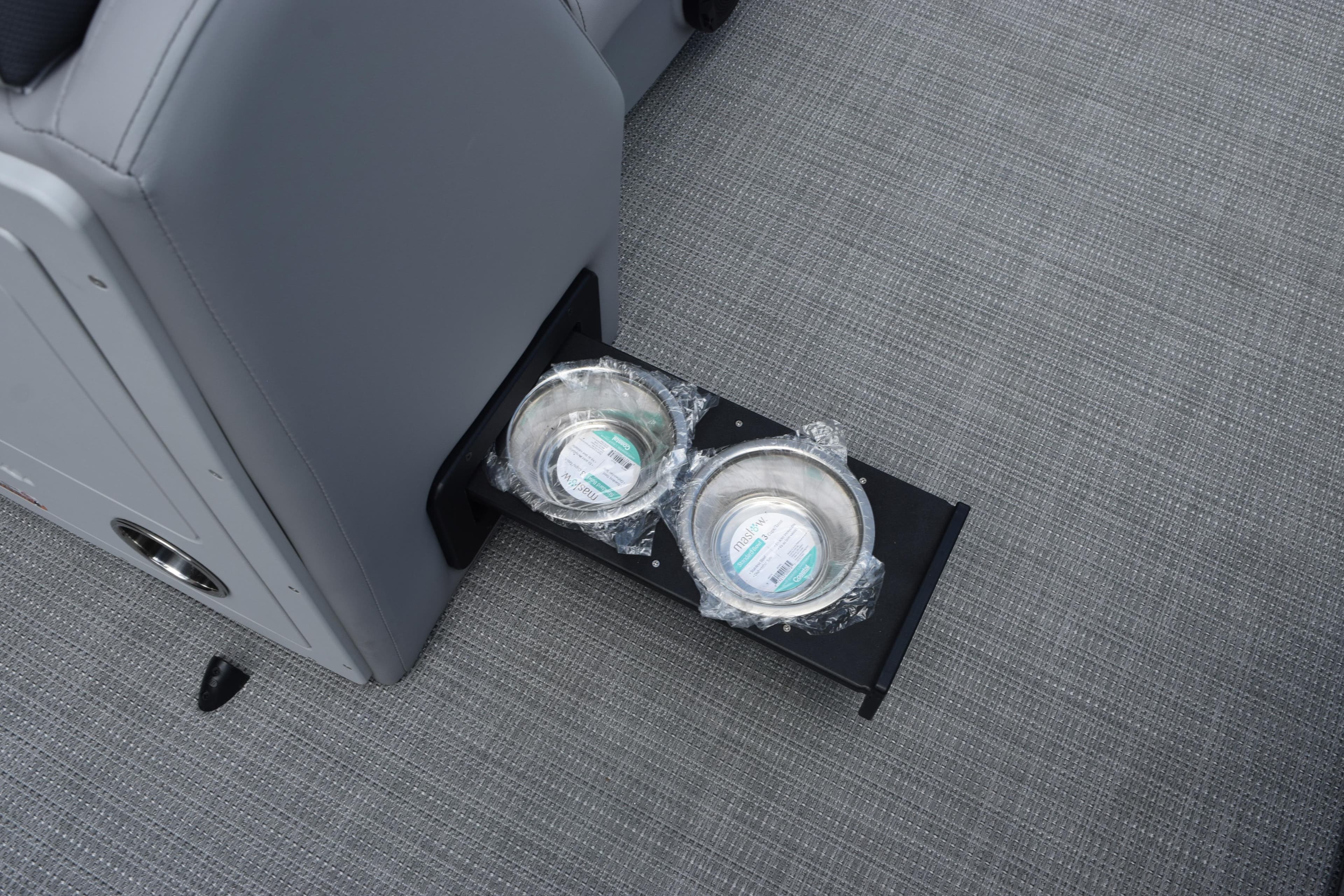 2026 Bentley Pontoons Legacy 243 Swingback with retractable cup holders on gray flooring.