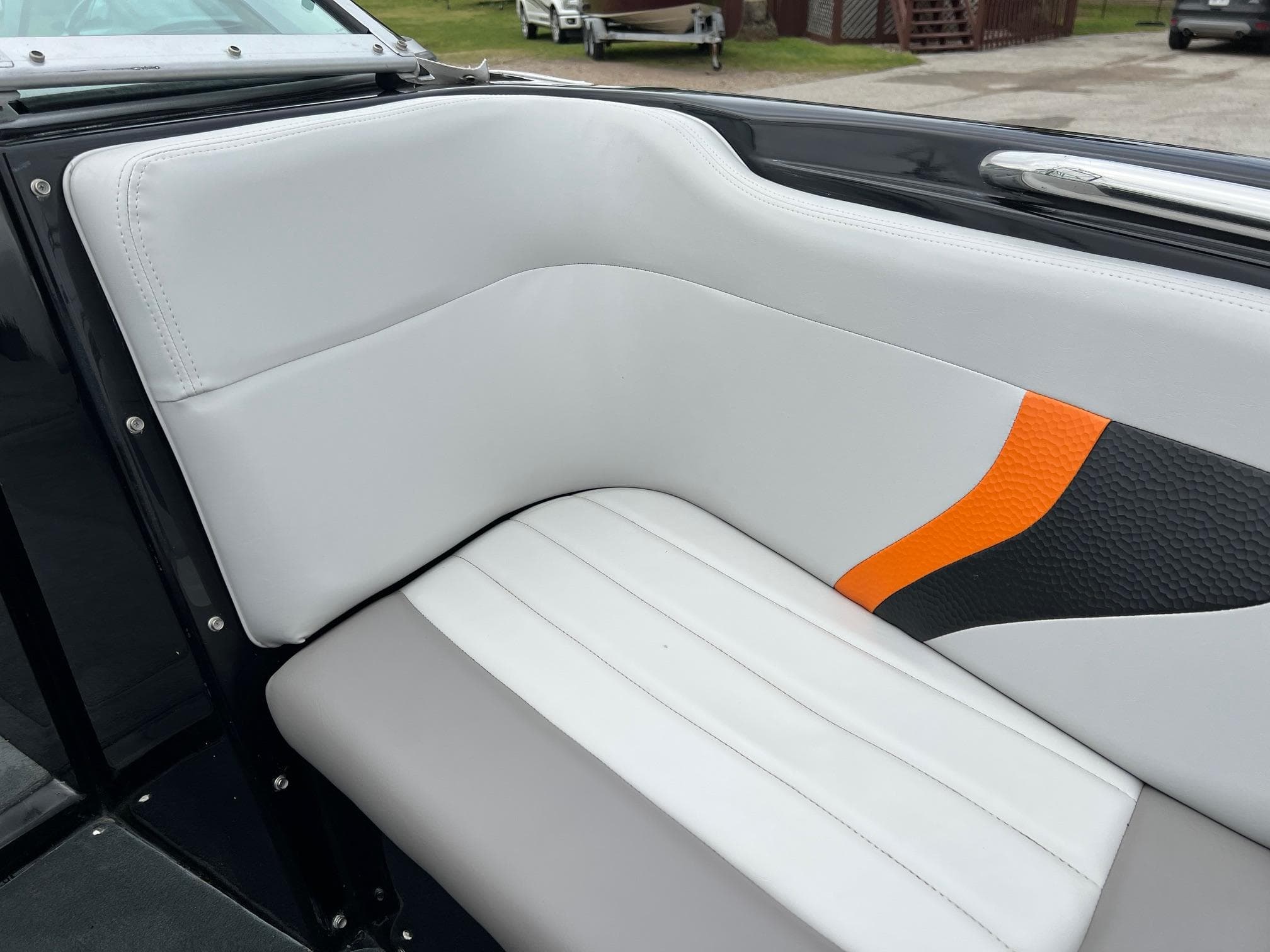 2006 MasterCraft X1 boat interior with white and orange upholstery.