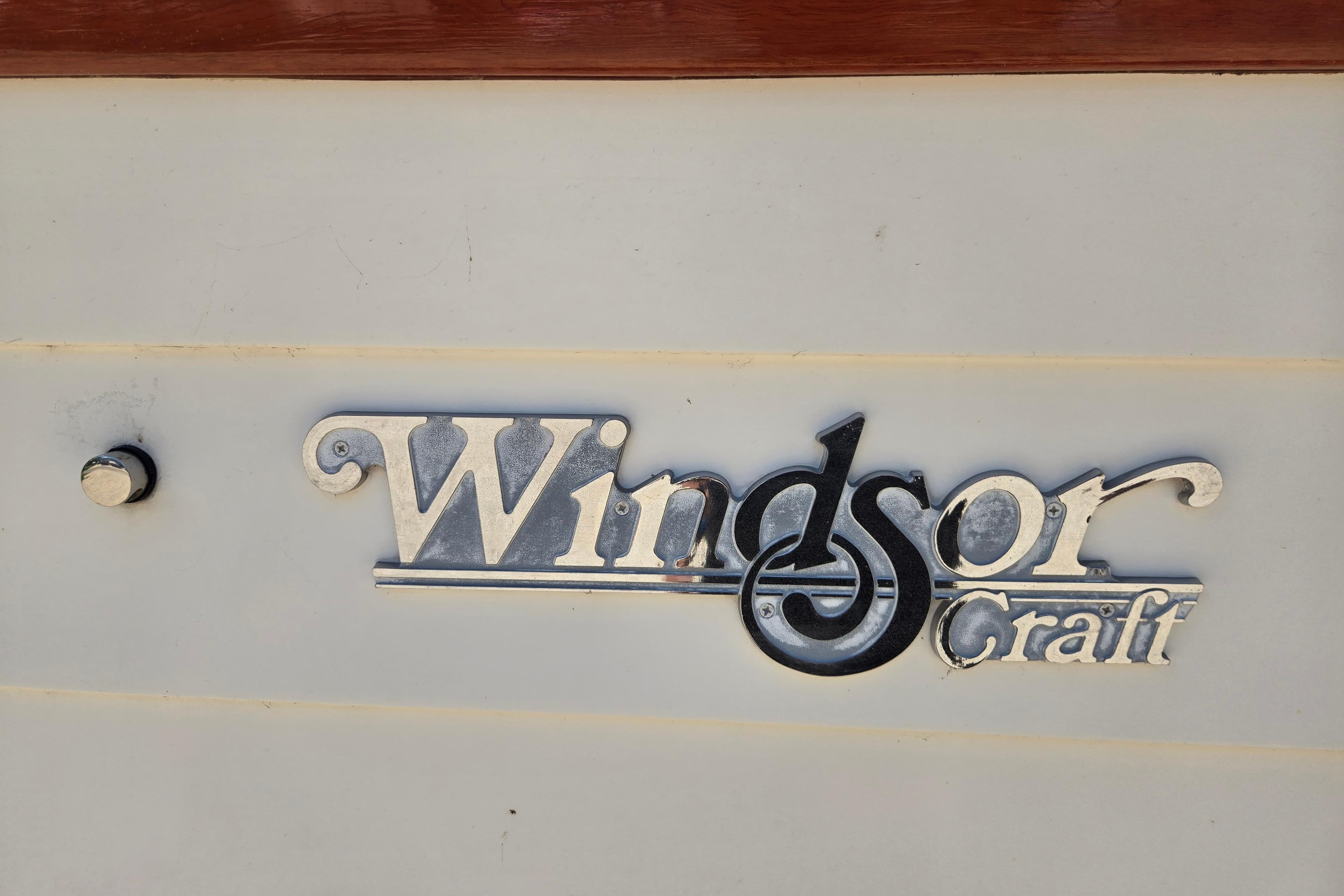 Windsor Craft Cuddy 1990 logo on boat exterior.