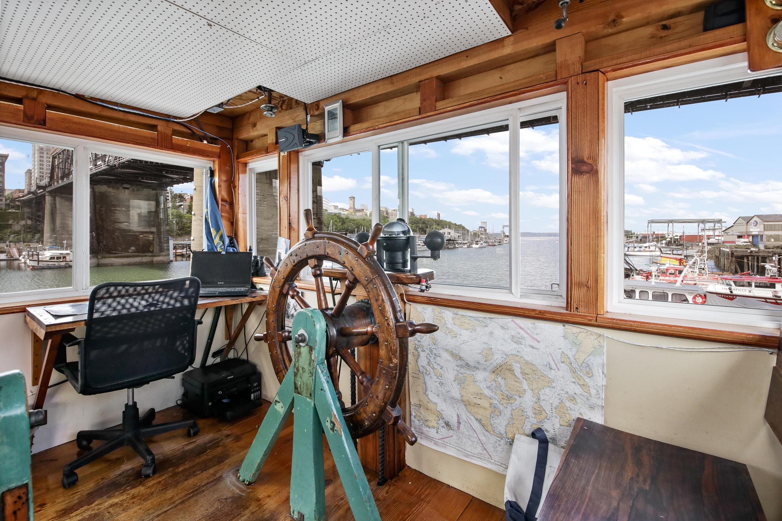 1938 Custom Ferry interior with vintage steering wheel and modern office setup.