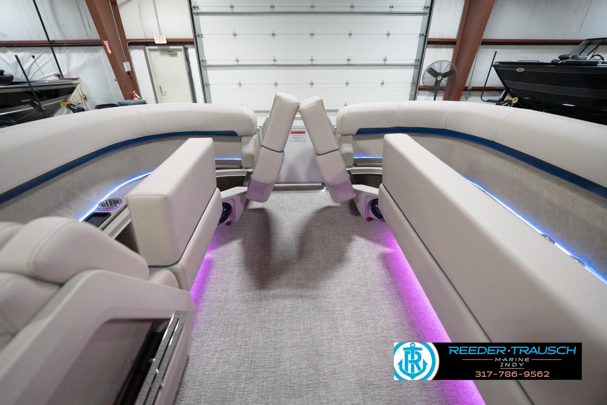 2026 Bennington 22 ML boat interior with plush seating and ambient lighting.