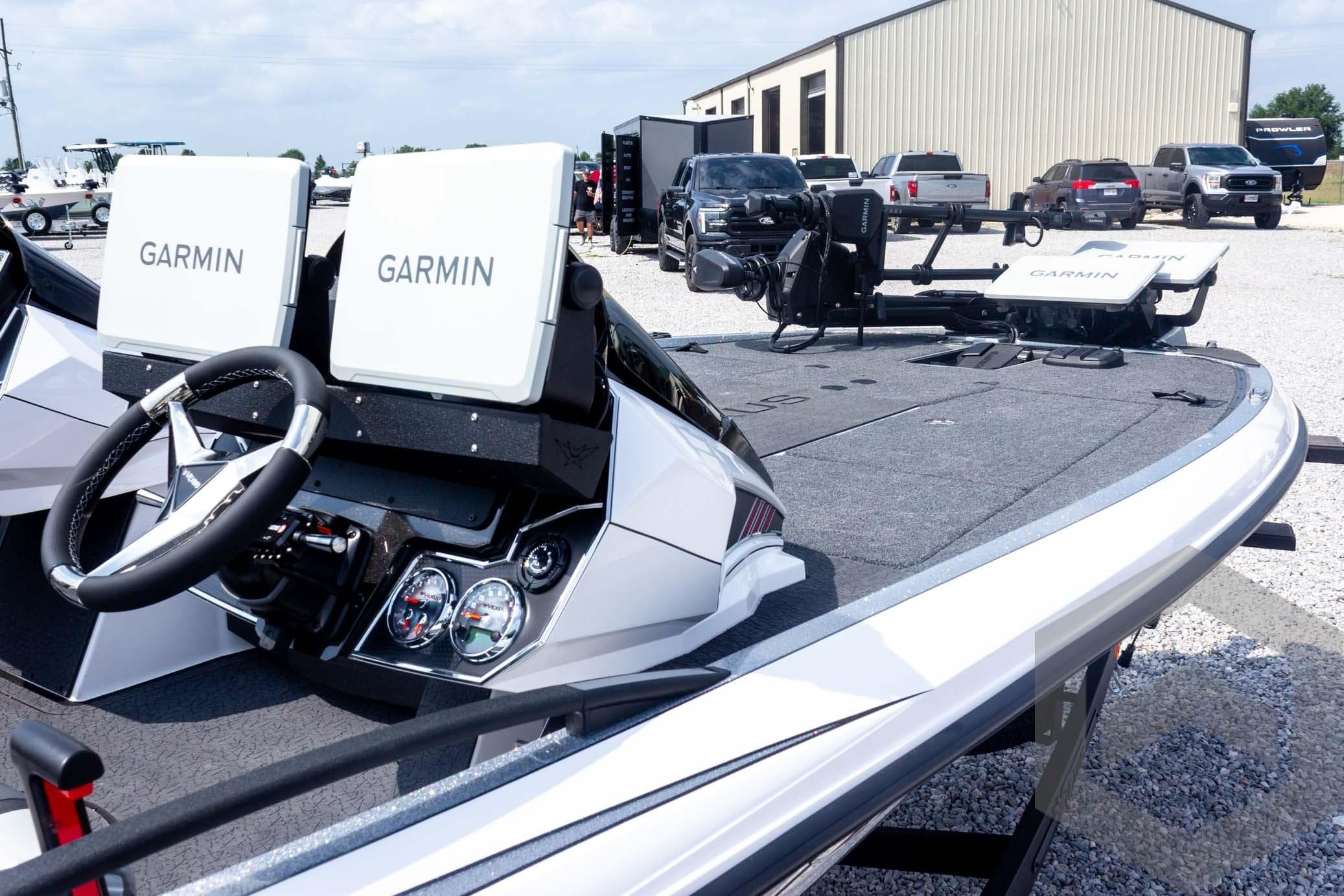 2026 Vexus VXs20 boat with Garmin electronics, steering wheel, and spacious deck.