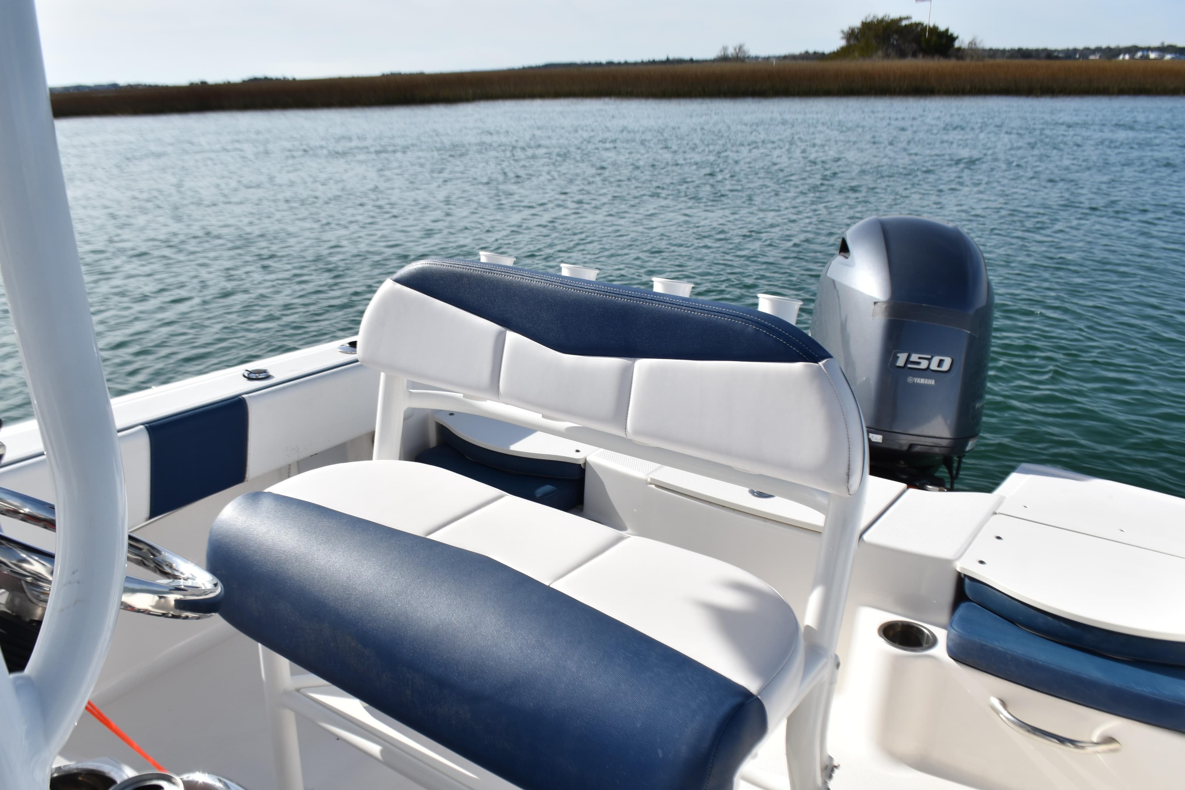 2021 Robalo R180 Center Console boat with Yamaha 150 engine on calm water.