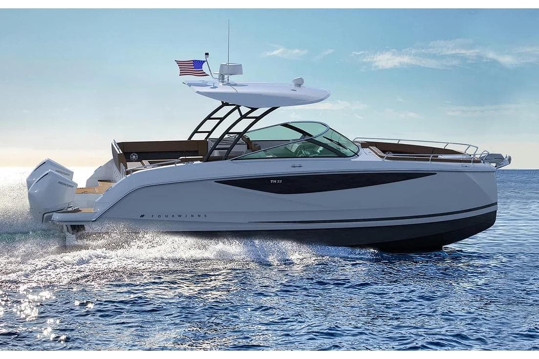 Manufacturer Provided Image: 2026 Four Winns TH33 boat cruising on open water, showcasing sleek design and powerful engines.