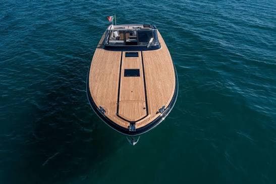 2023 Itama 45RS luxury yacht with sleek wooden deck on open water.