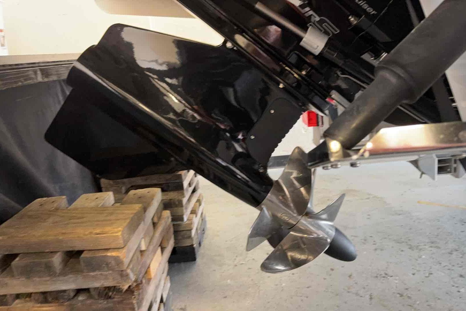 2025 Chaparral 260 Surf boat propeller and drive system on wooden blocks.