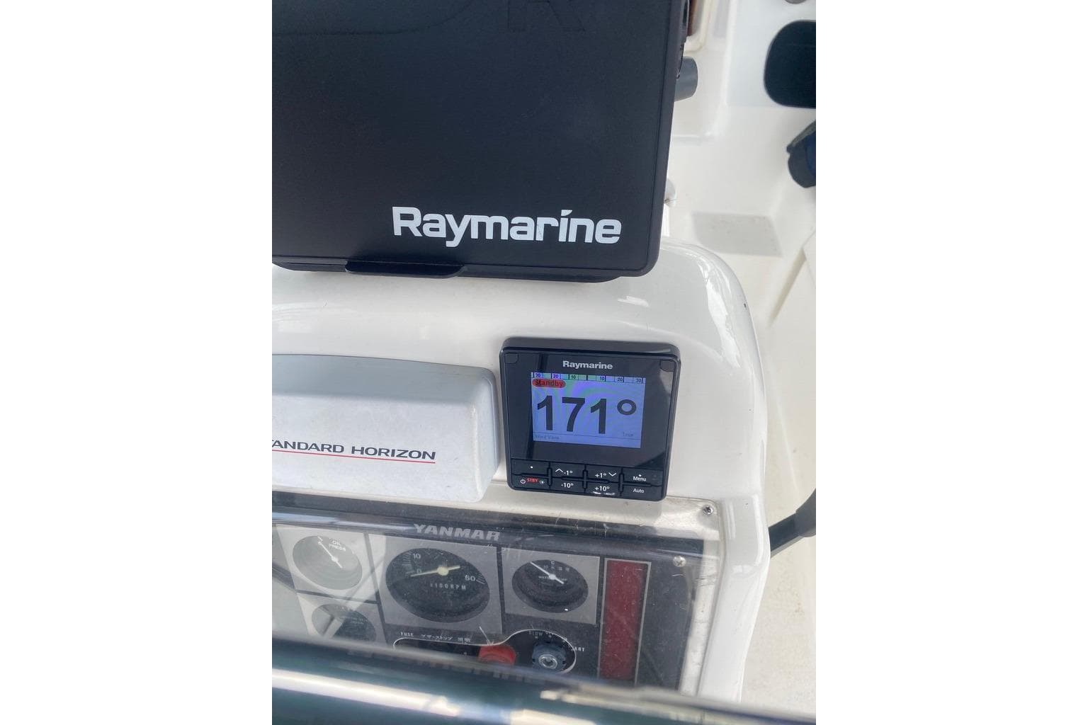 Control panel of a 1996 Hunter Legend 40.5 sailboat with Raymarine instruments.