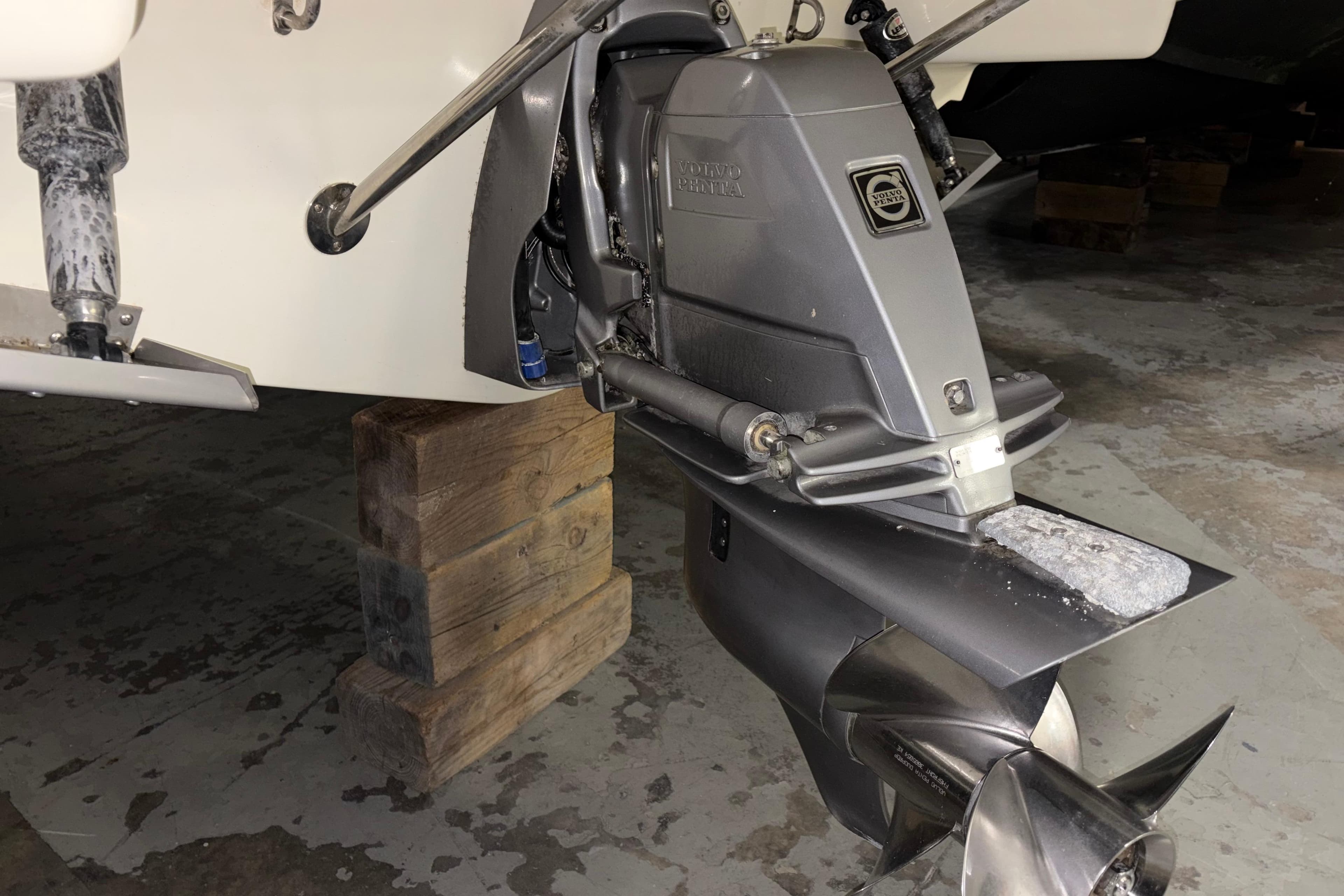 2020 Chris-Craft Launch 28 GT boat engine on wooden blocks in a garage.