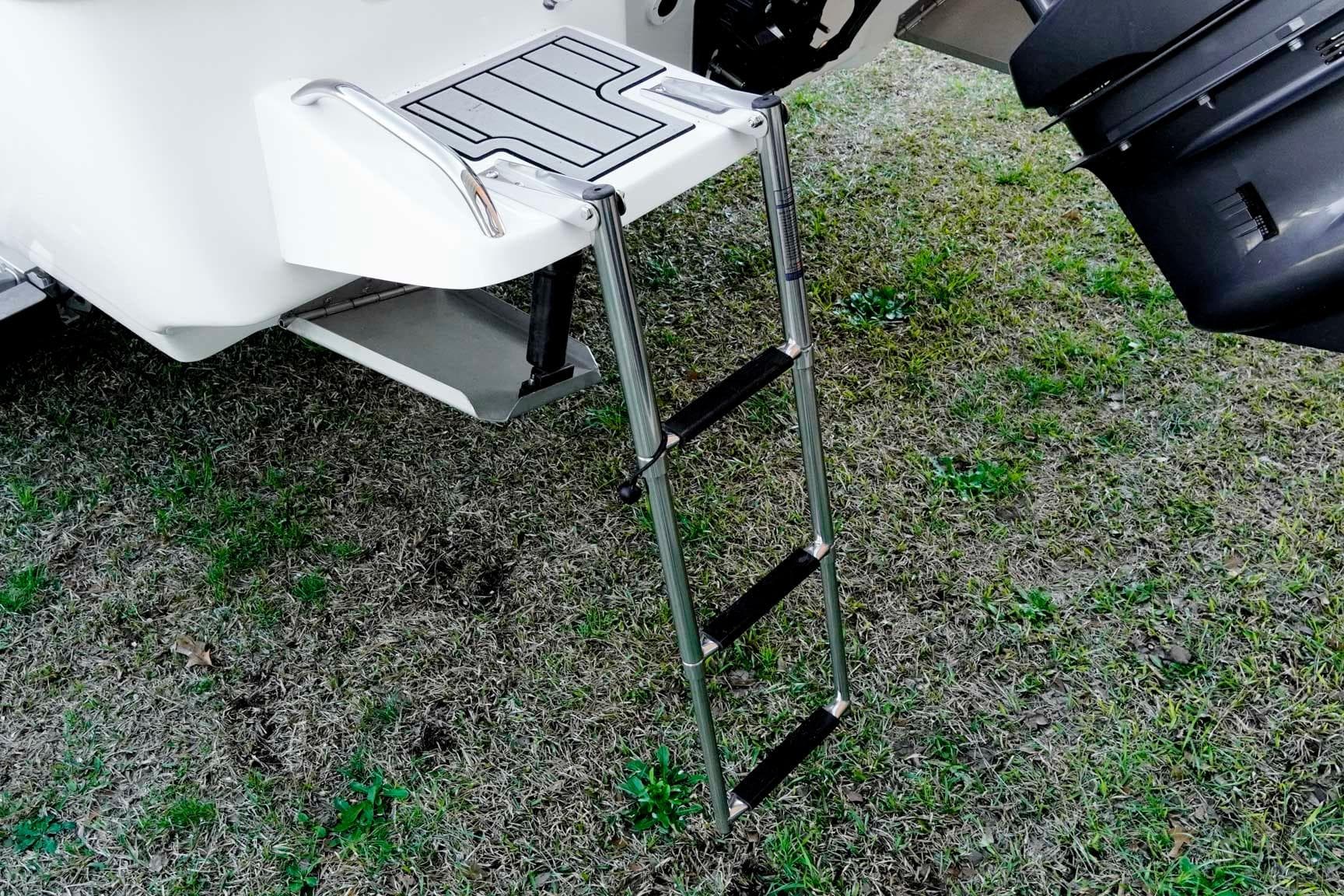 2026 Tidewater 2110 Bay Max boat ladder on grassy surface.