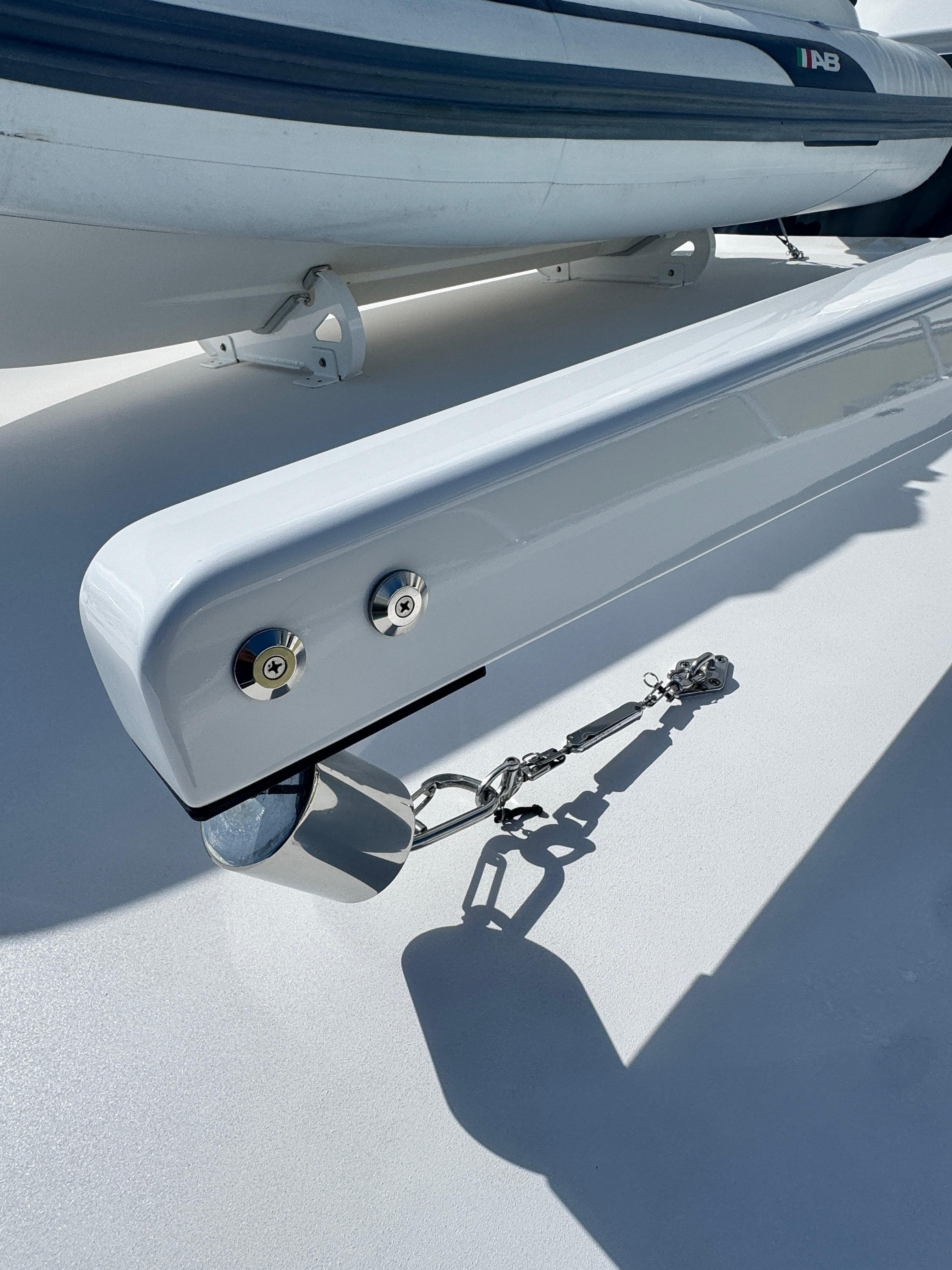 2011 Hatteras GT60 yacht deck with davit and tender.