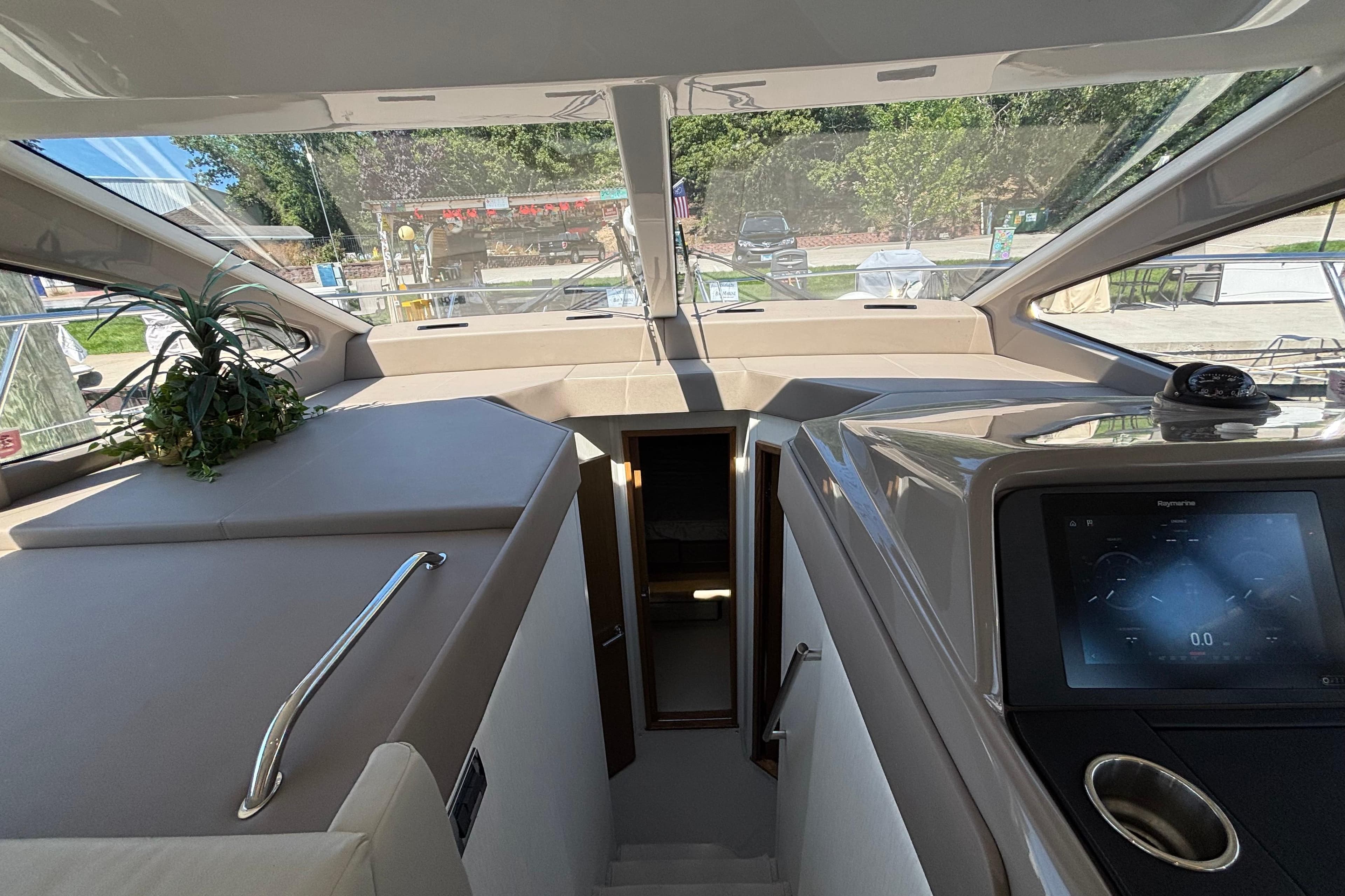 Interior view of 2018 Sea Ray Sundancer 460 yacht, featuring modern dashboard and sleek design.
